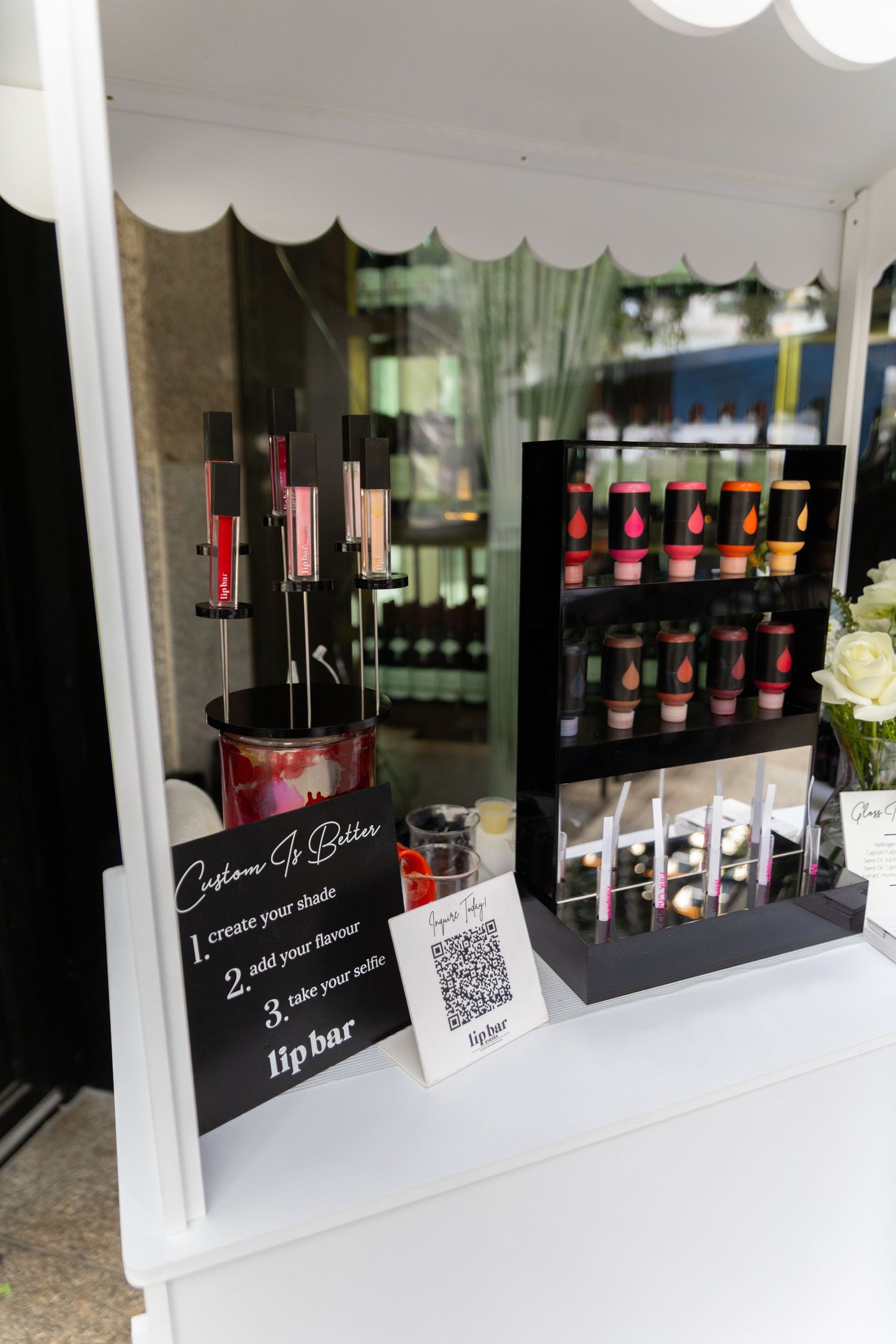 Event photo of lip gloss making station at bridal shower.