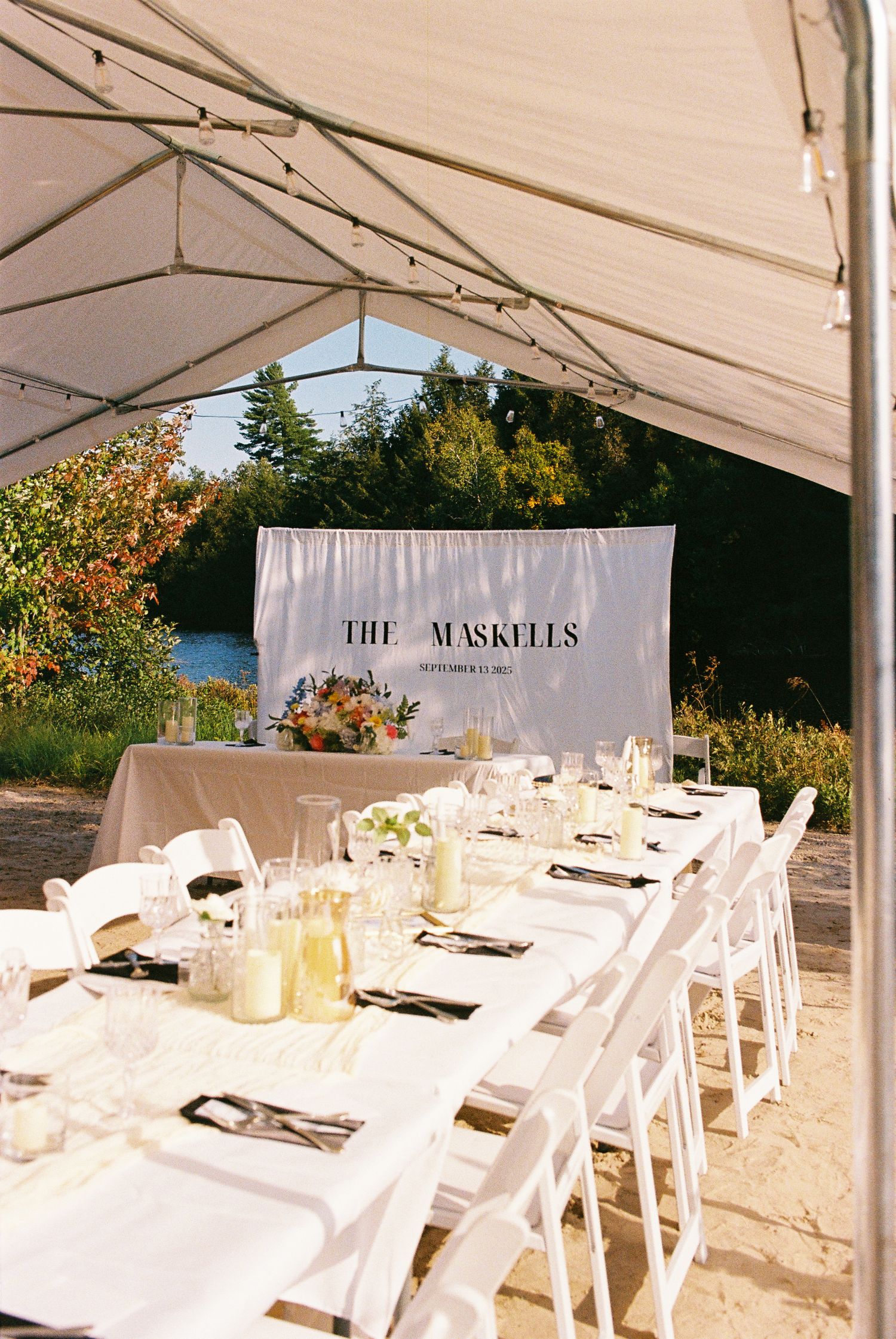 Wedding reception dinner style set up on a beach captured on 35mm film.