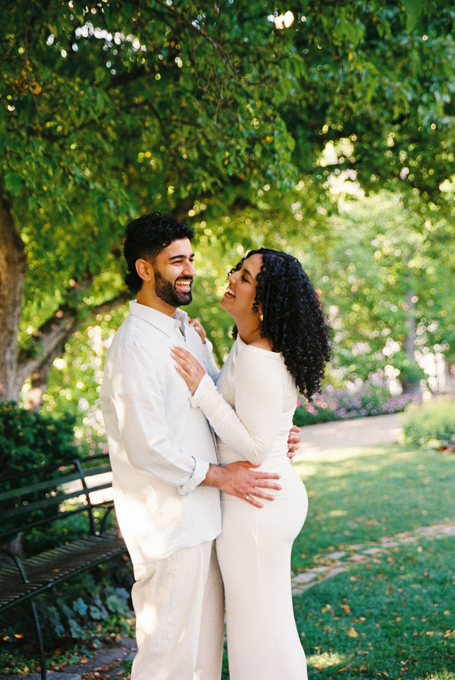 Fiancés standing in the Toronto Music Gardens together for their engagement photos.