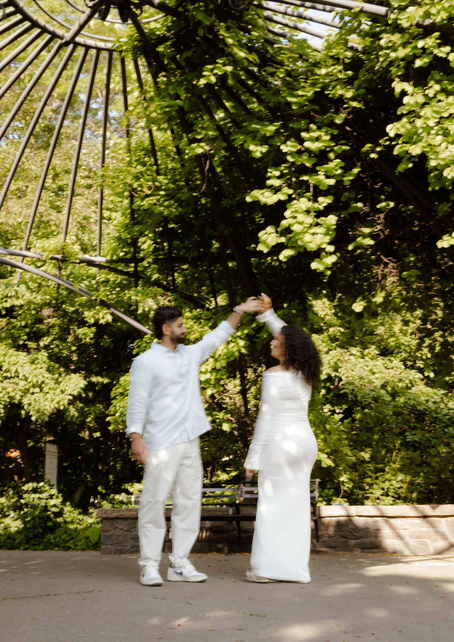 Fiancés standing in the Toronto Music Gardens together for their engagement photos.