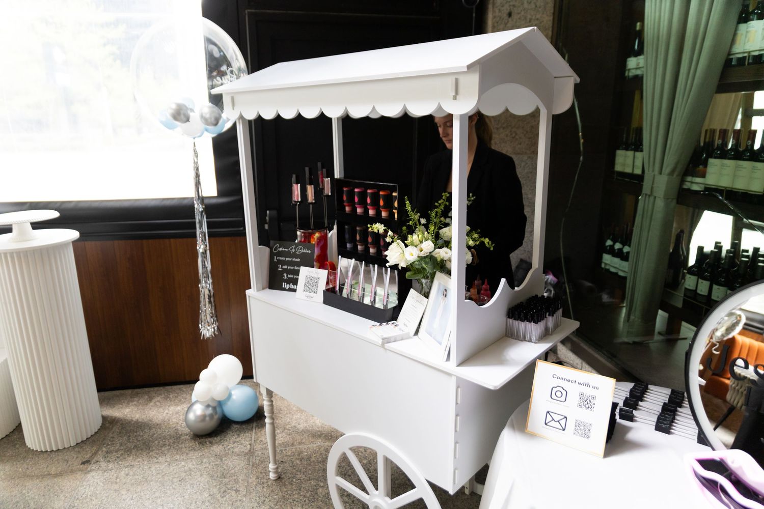Event photo of lip gloss making station.