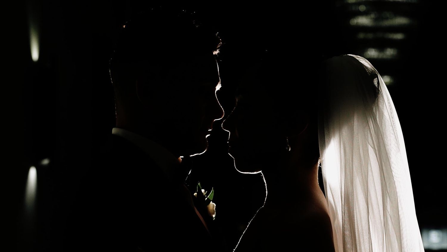 Artistic black and white silhouettes create dramatic shadows in an intimate setting.