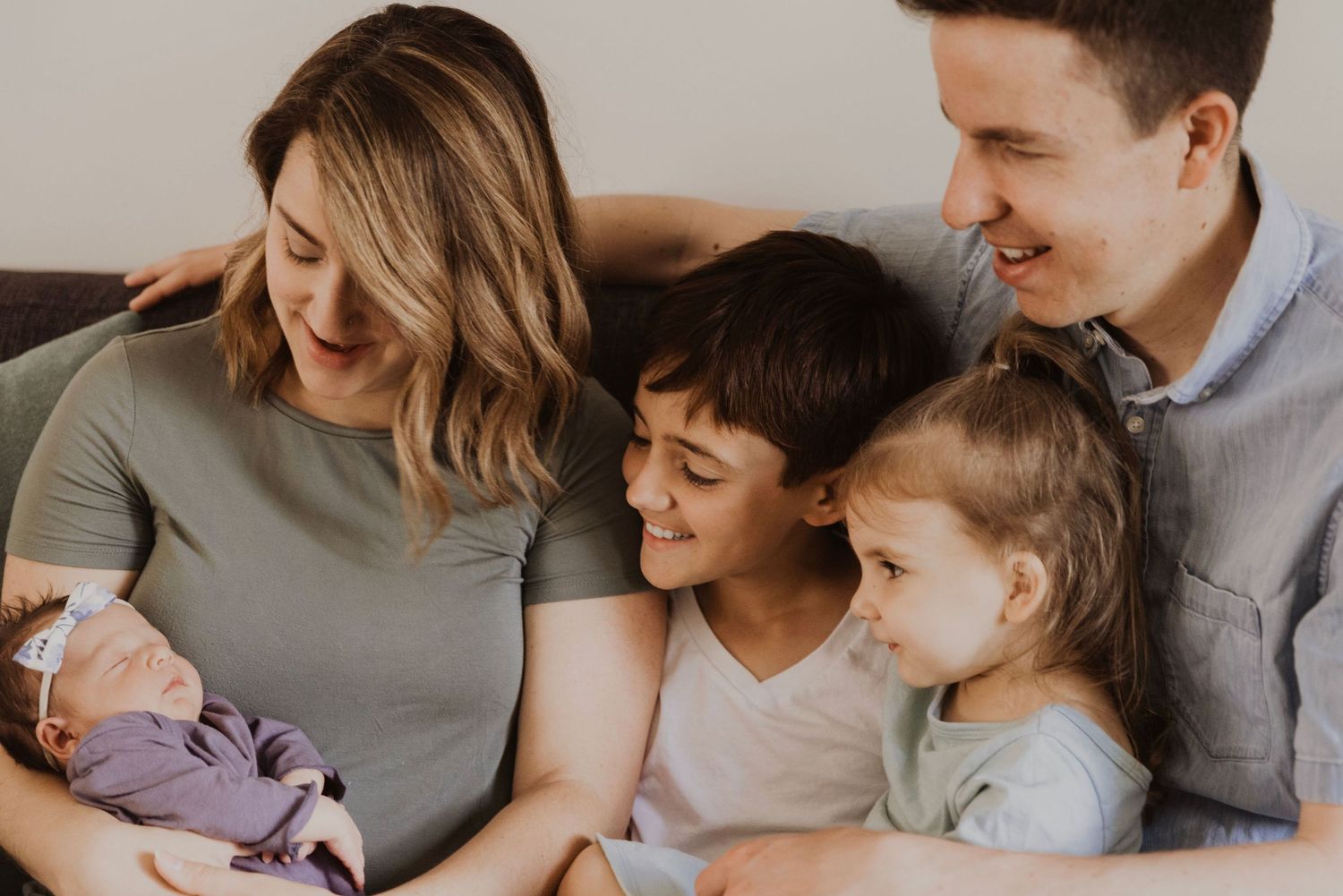 Candid family moment captured in soft natural light showing closeness and connection.