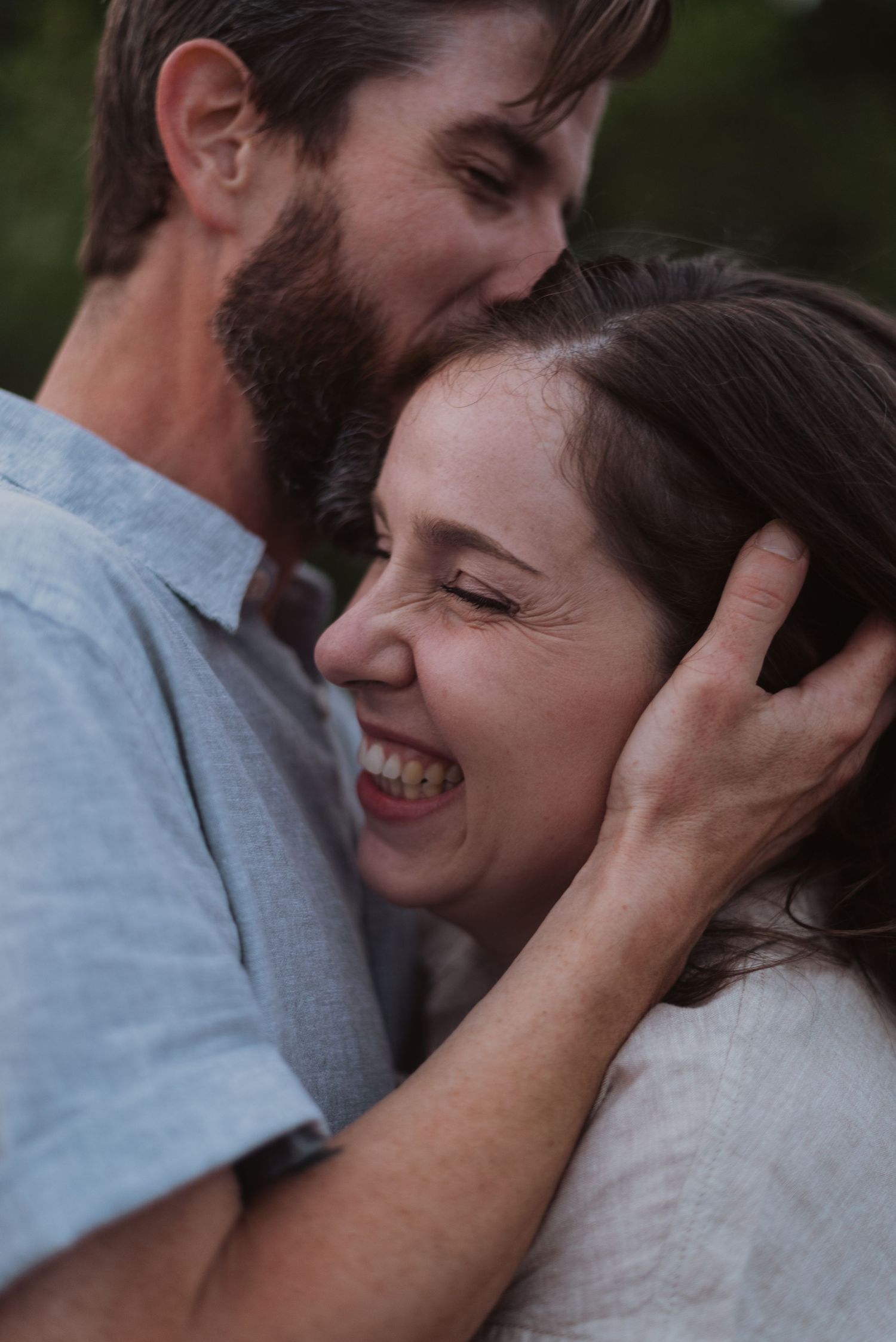 Couple sharing intimate emotional moment outdoors.