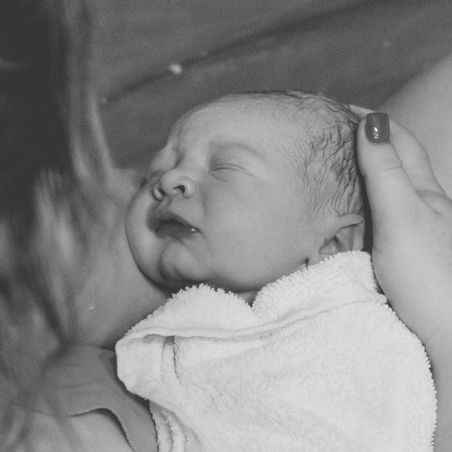 mother meeting her newborn baby during birth in northern utah