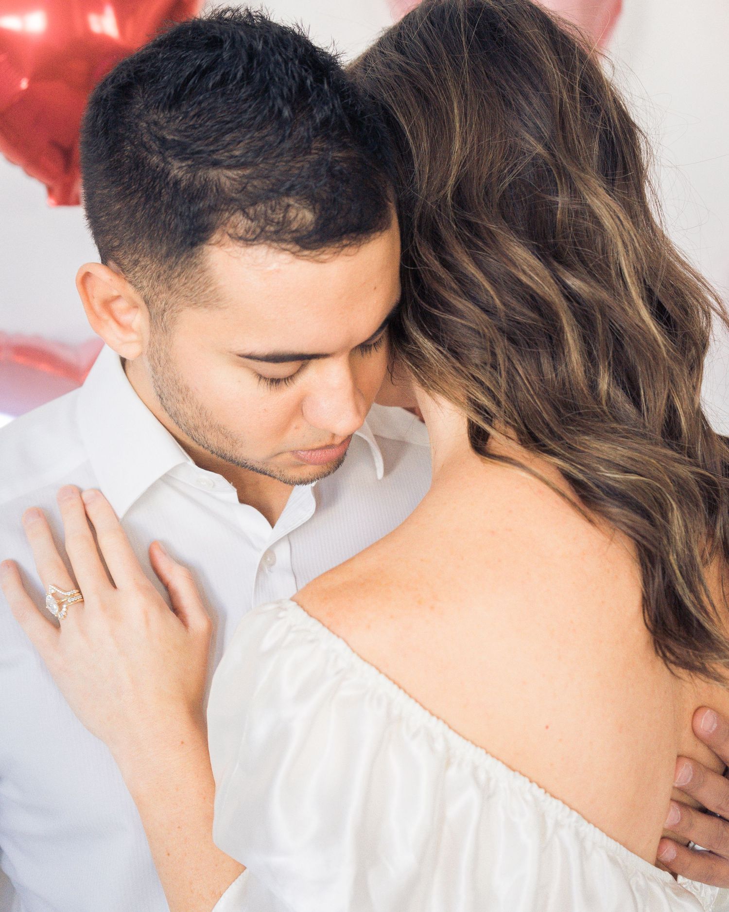 Romantic engagement photo of a couple embracing, capturing an intimate and emotional love story by Sweetly Kept Photography