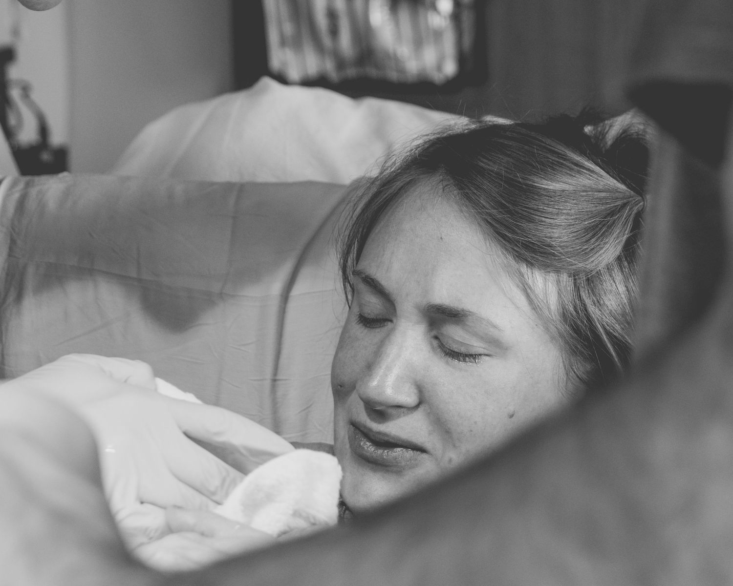 mother breathing through contractions during hospital birth