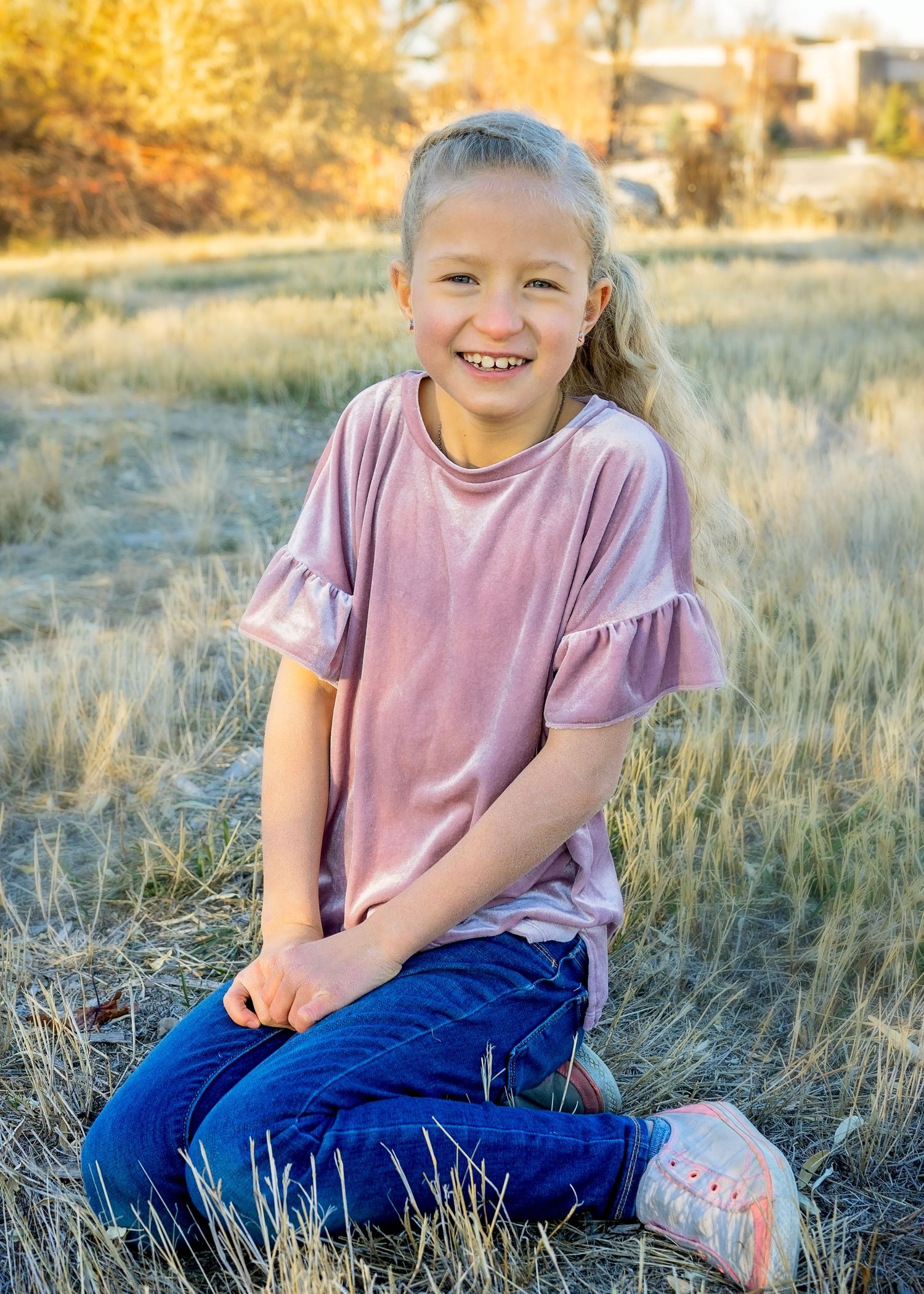 Girl in field smiling