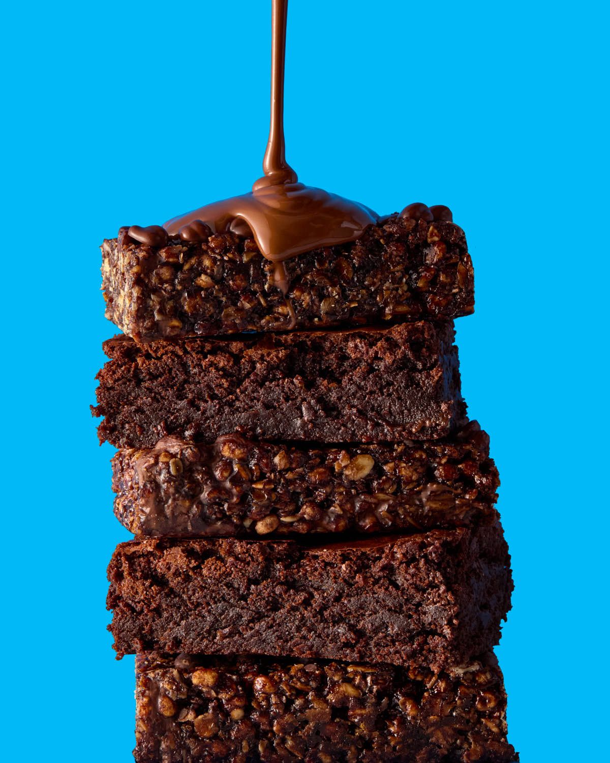 TRIBE protein energy bars with melted chocolate pour - food photography - Nancy Anne - product photographer London