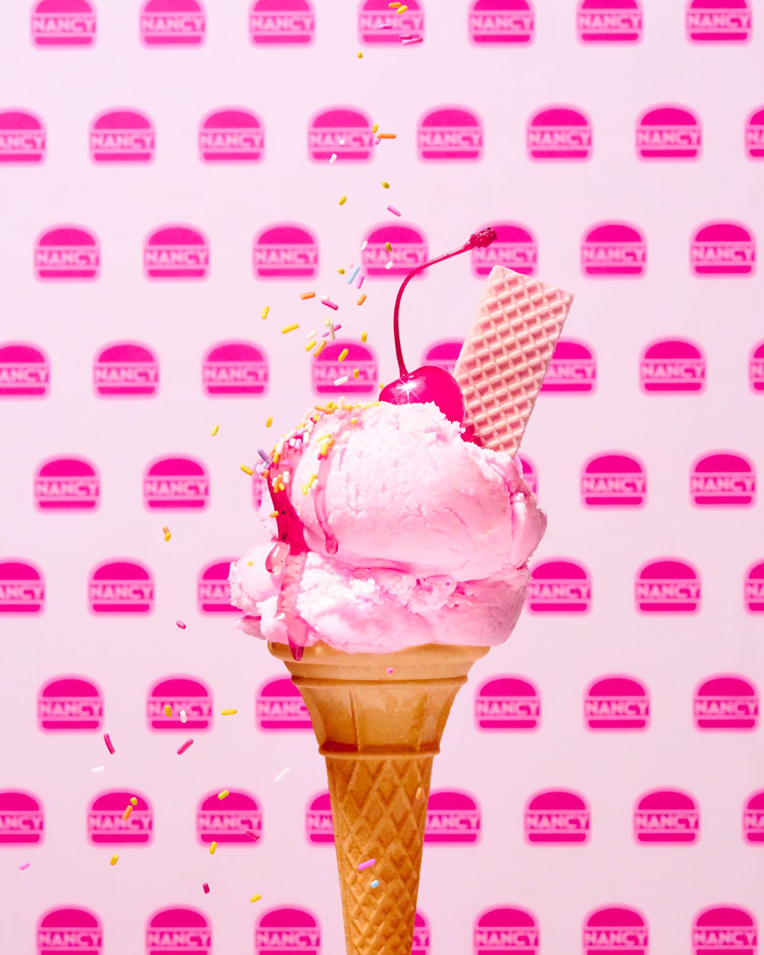 Strawberry ice cream with cherry and sprinkles - Wimpy creative pink burger shop photography - food photography - Nancy Anne