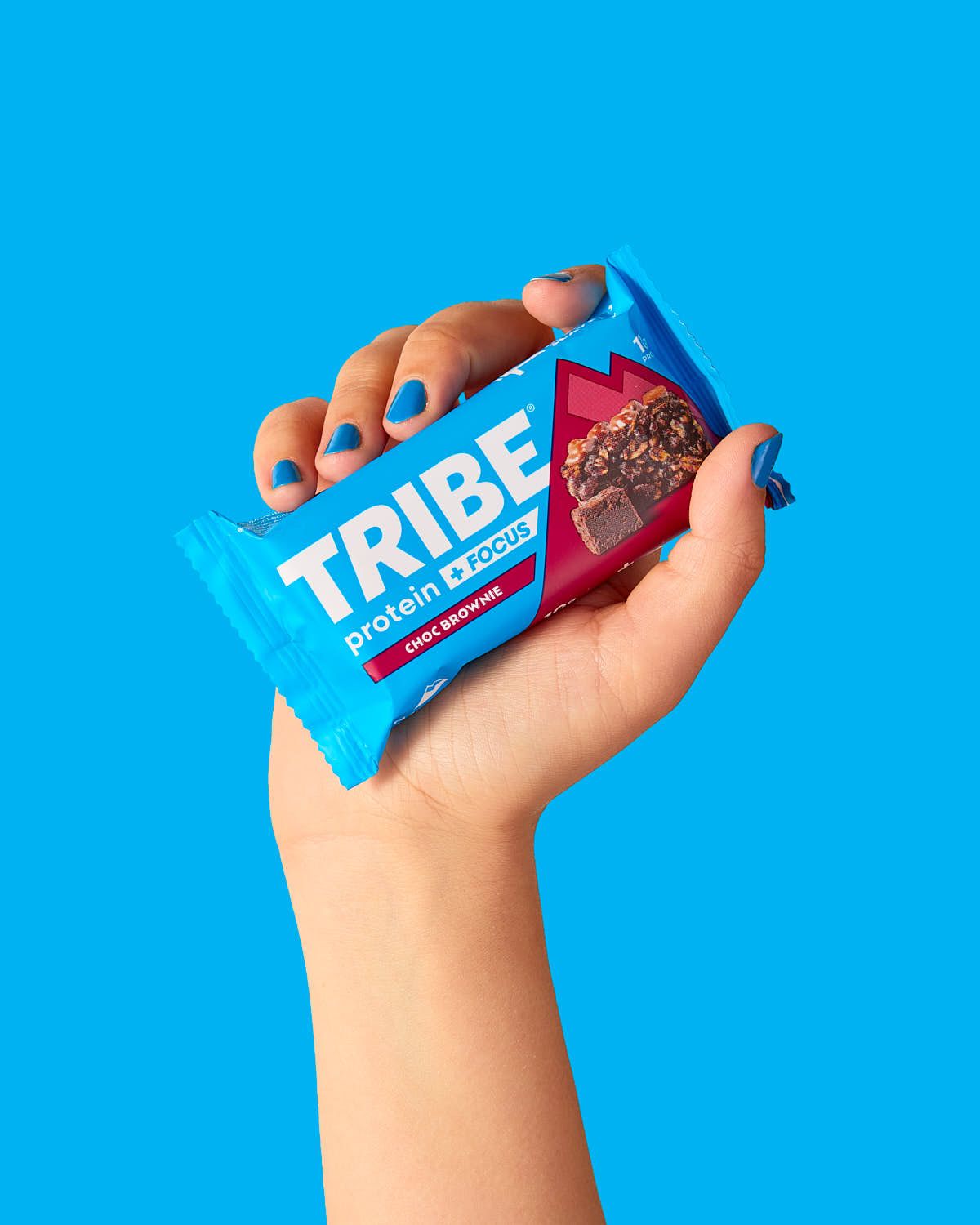 TRIBE protein energy bars with hand model - food photography - Nancy Anne - product photographer London