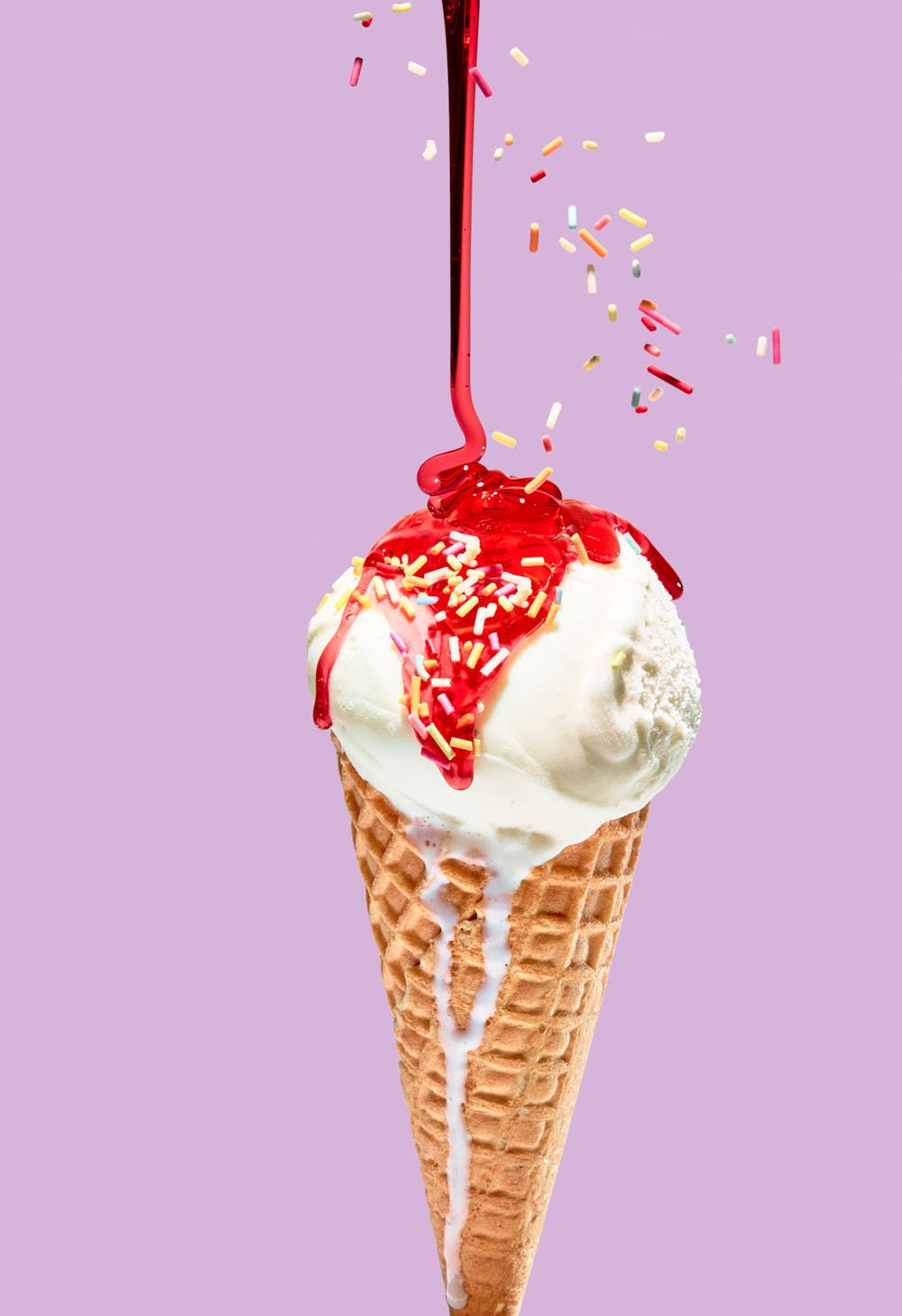 Sunny summer BBQ food photography – ice cream cone with strawberry sauce