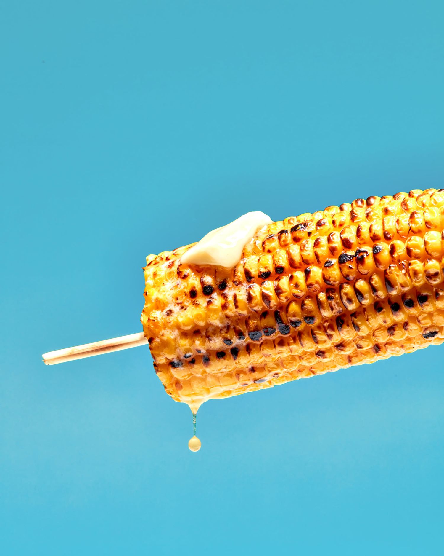 Sunny summer BBQ food photography – grilled corn with melted butter