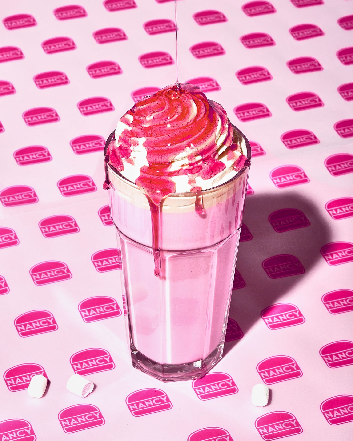 Strawberry milkshake with pouring strawberry sauce - Wimpy creative pink burger shop photography - food photography - Nancy Anne