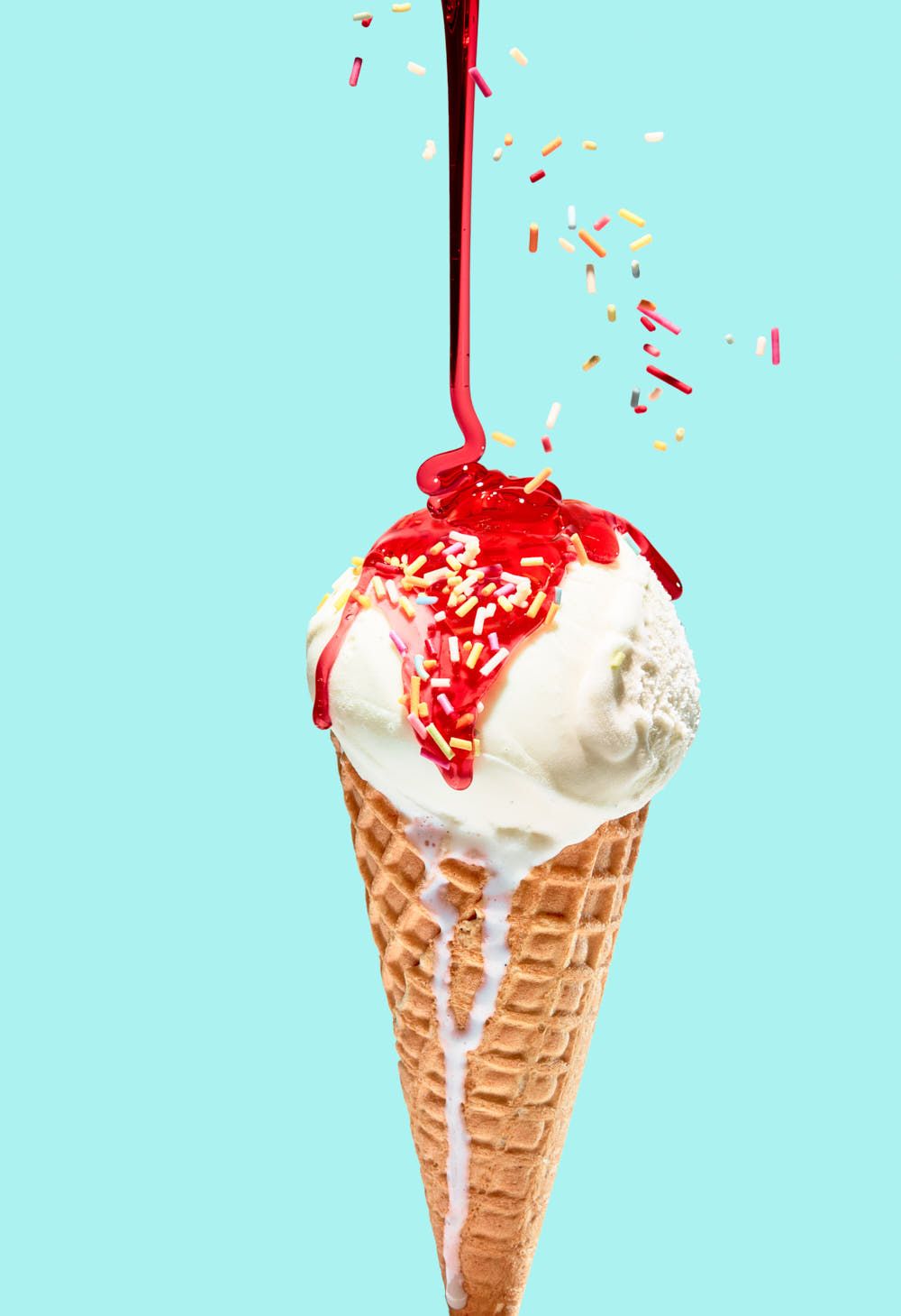 Sunny summer BBQ food photography – ice cream cone with strawberry sauce