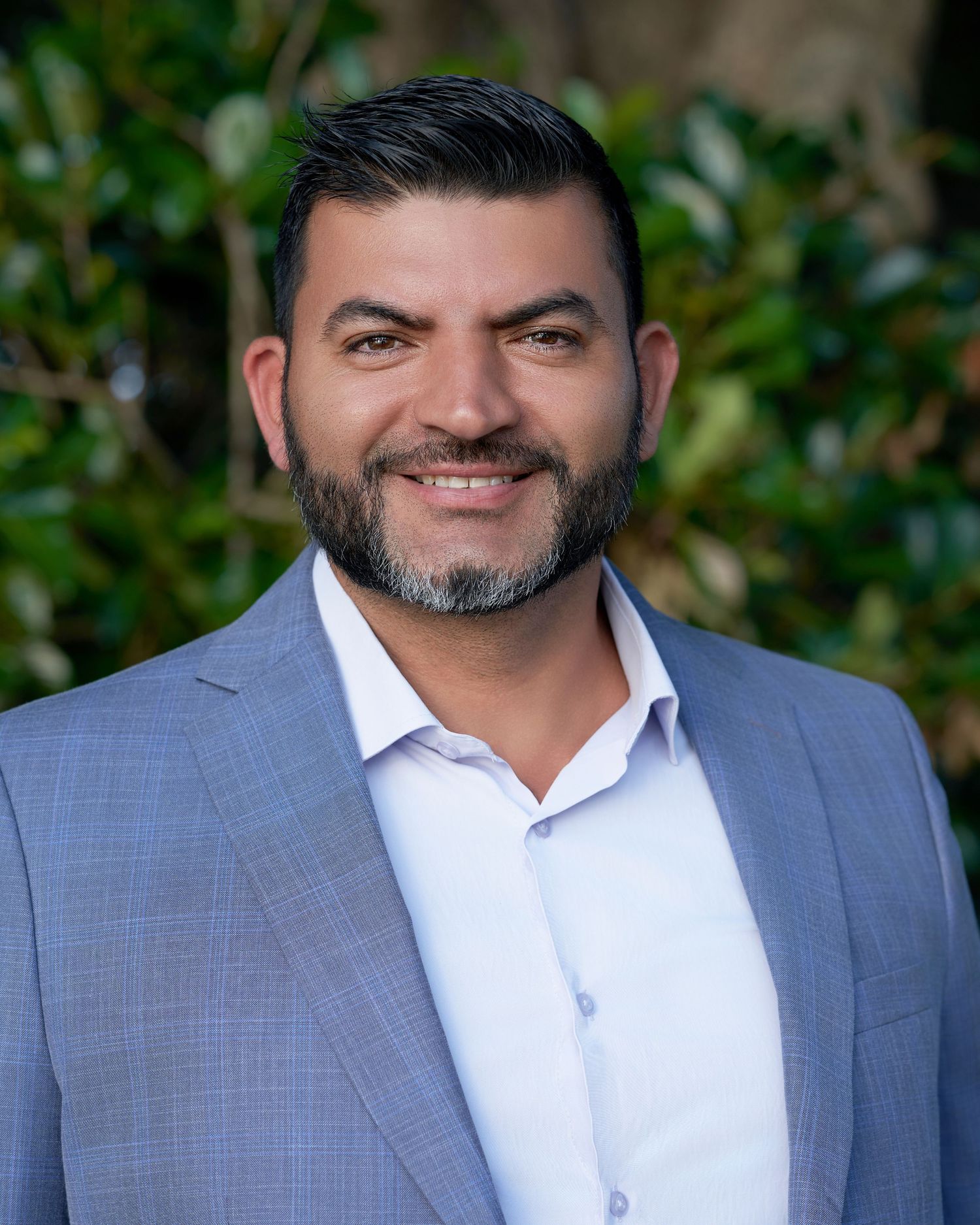 Professional outdoor portraits featuring a man in a gray suit and white shirt combination.