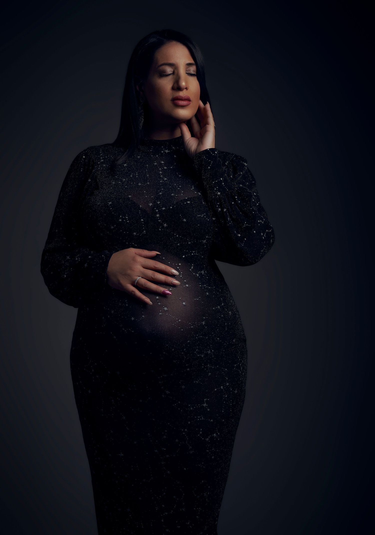 Dramatic dark studio portraits featuring sparkly black evening wear.