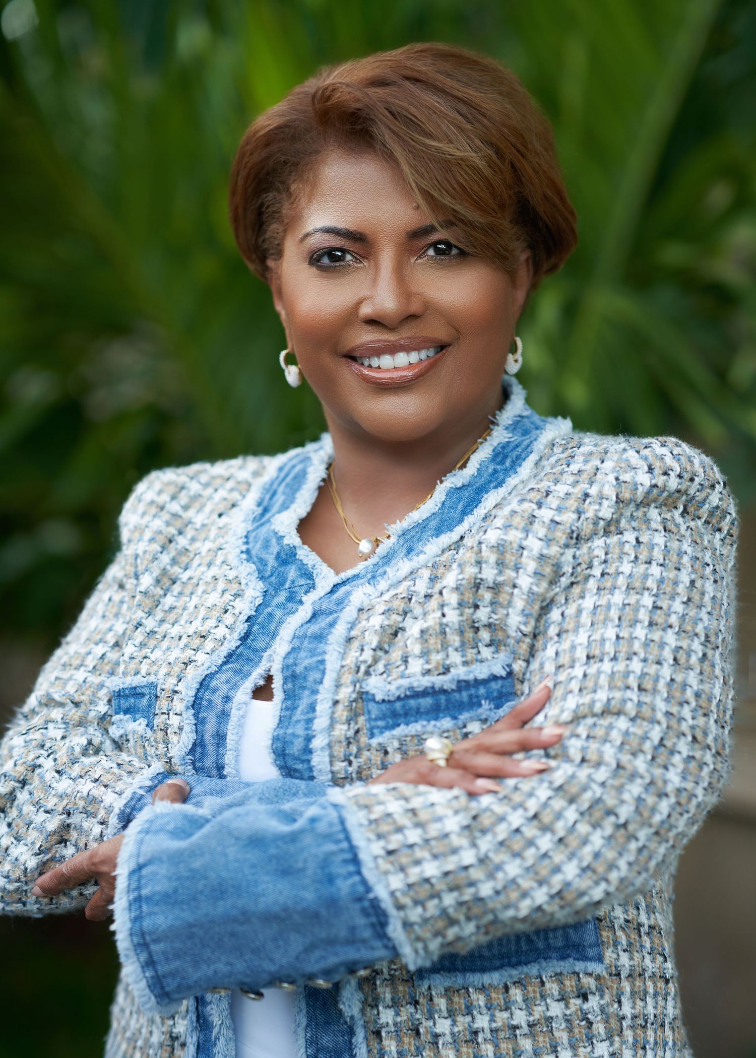 Portrait series showing a person in a tweed jacket and denim outfit against an outdoor background.
