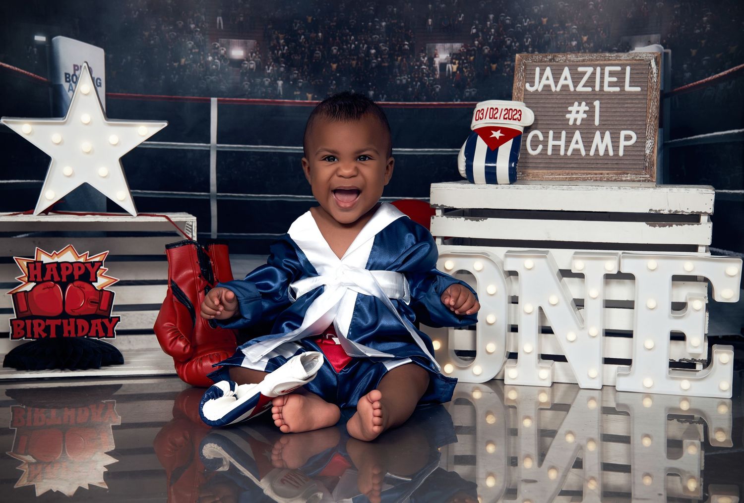 Baby milestone photo series with sports theme and letter props.