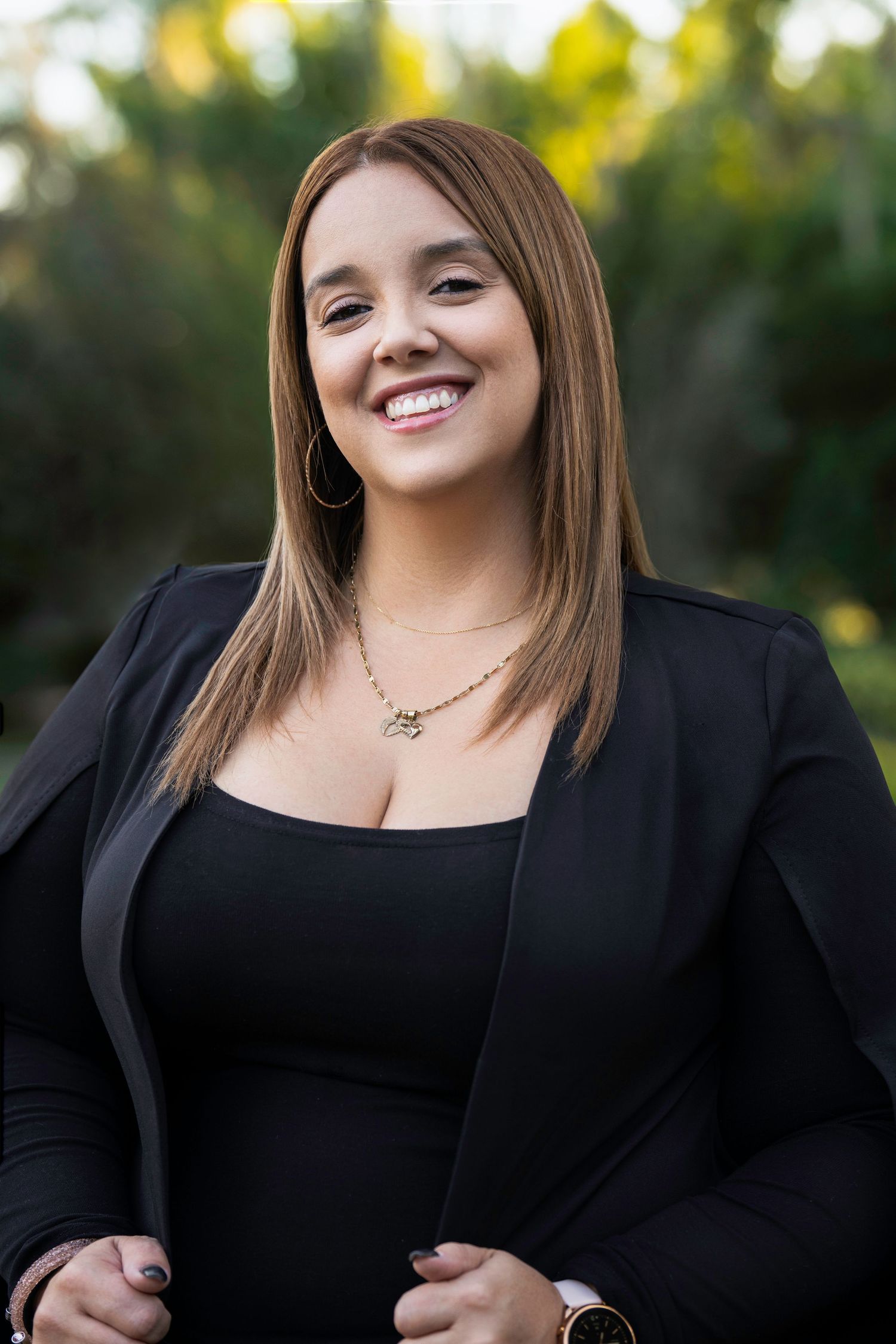 Professional portrait series showing joyful expressions against a natural outdoor background.