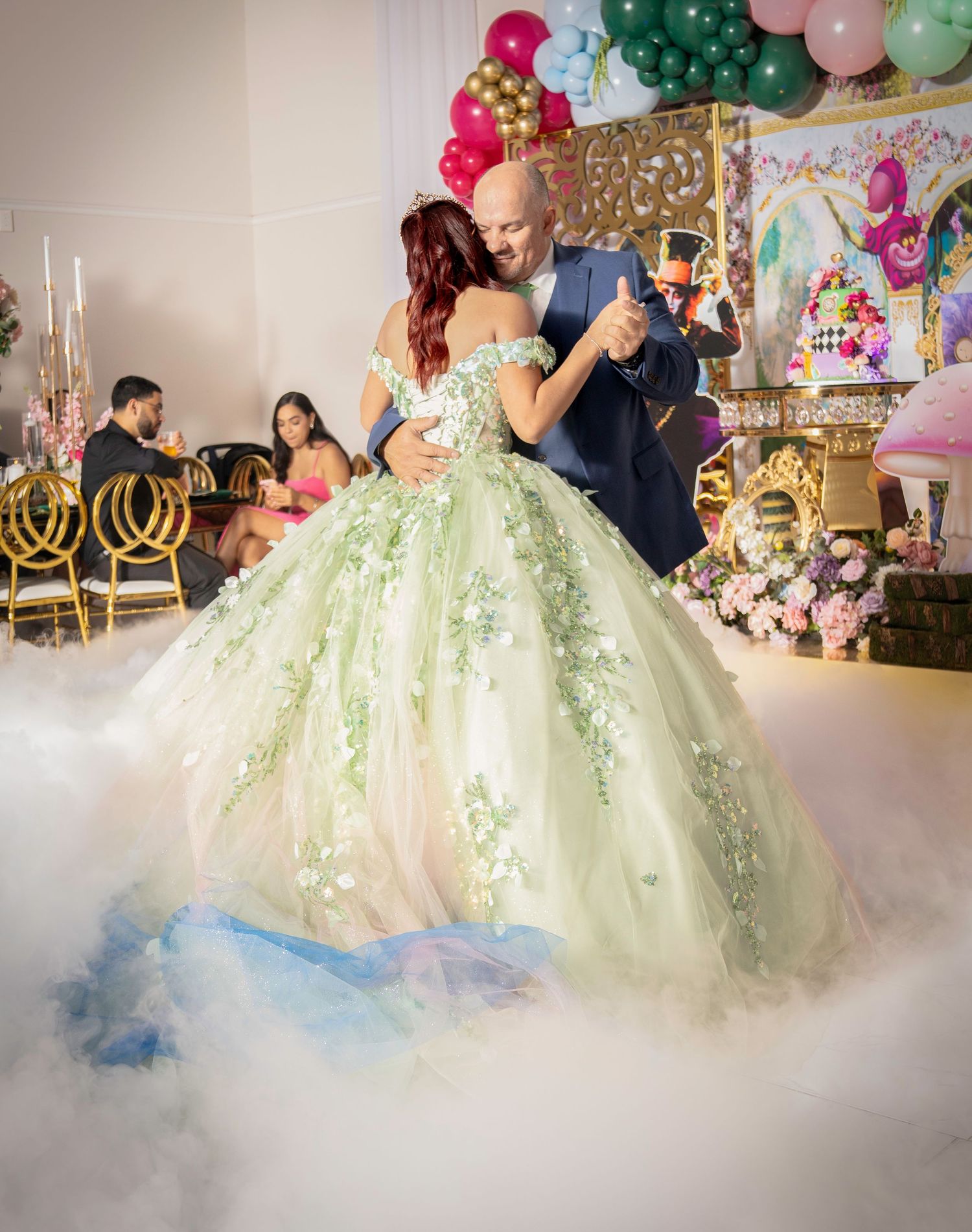 A dreamy ballroom scene with a flowing mint green ball gown surrounded by pastel balloons and decorative lighting.