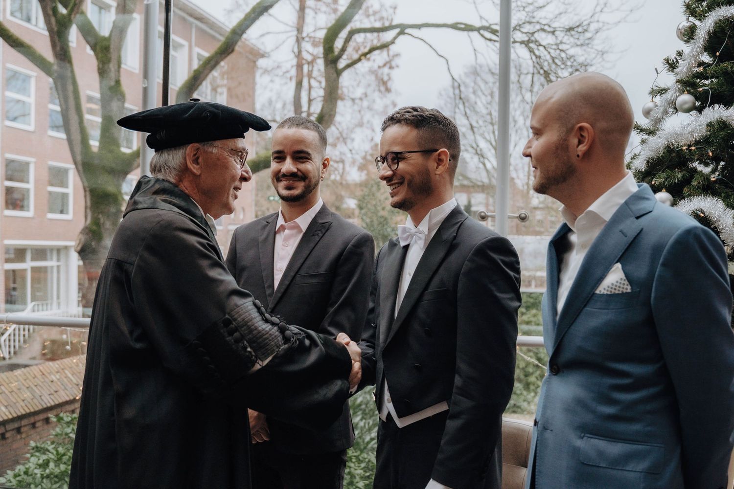 Professor congratulating PhD candidate