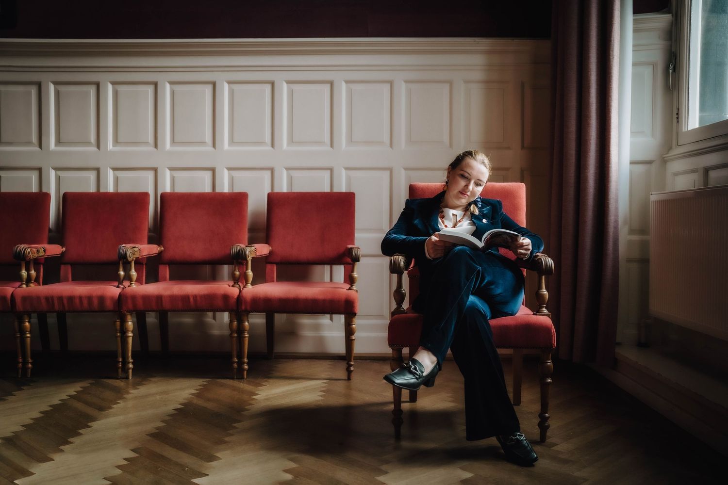 PhD student with book