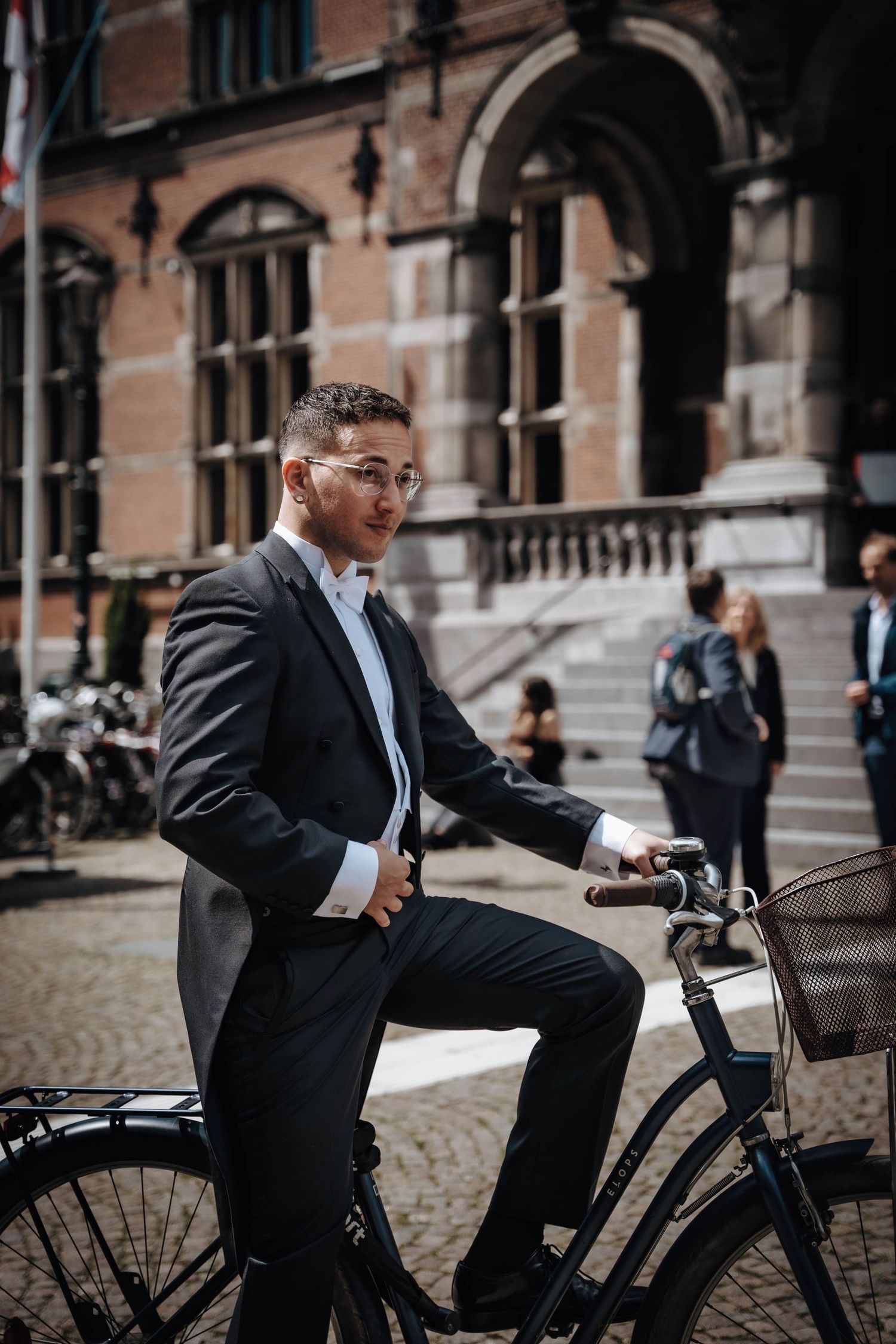 PhD candidate posing outside of the academiegebouw after the PhD defence