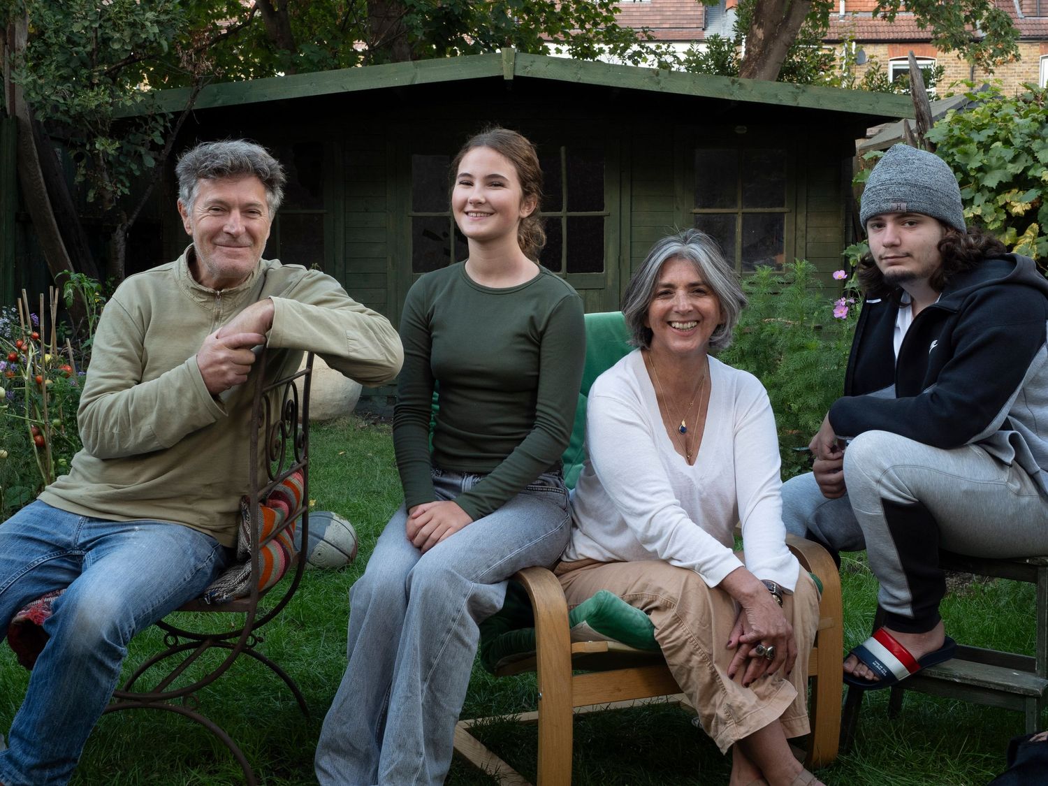 Family group relaxing together in garden setting, for family photograph for 'Before they Fly the Nest'
Photograph by Danny Elwes