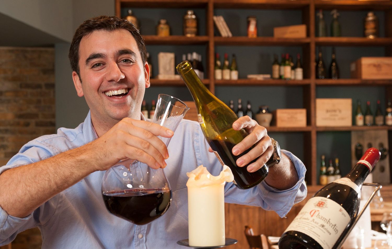 A series of wine pouring and tasting shots in a rustic restaurant setting with wooden shelves.
Photograph by Danny Elwes