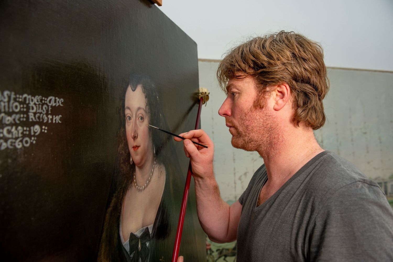 Art restorer working on old oil painting. For commercial photographic shoot on art restoration at Houghton Hall
Photograph by Danny Elwes