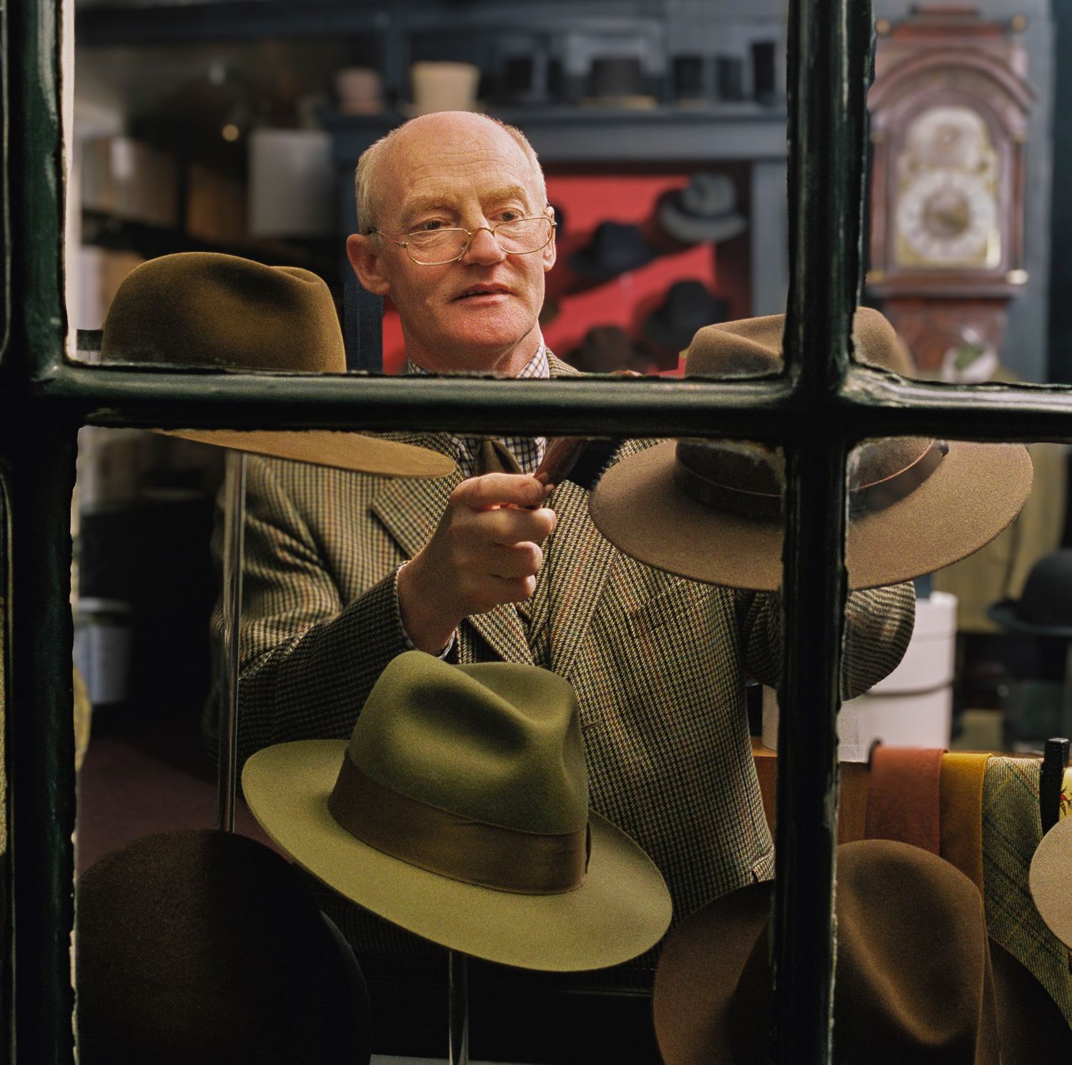 Arranging hats in the shop window of Bates Gentlemen’s Hatters (est. 1898)  St James's, London
Photograph by Danny Elwes