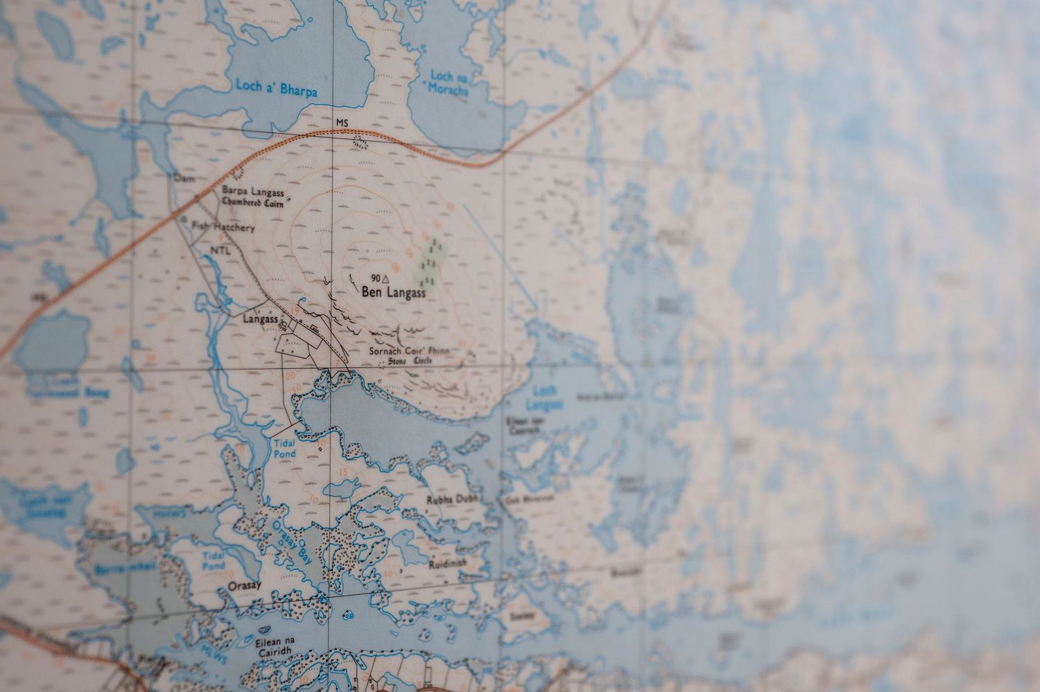 Close-up of a vintage topographic map showing coastal waterways, bays, and lagoons with blue water features.