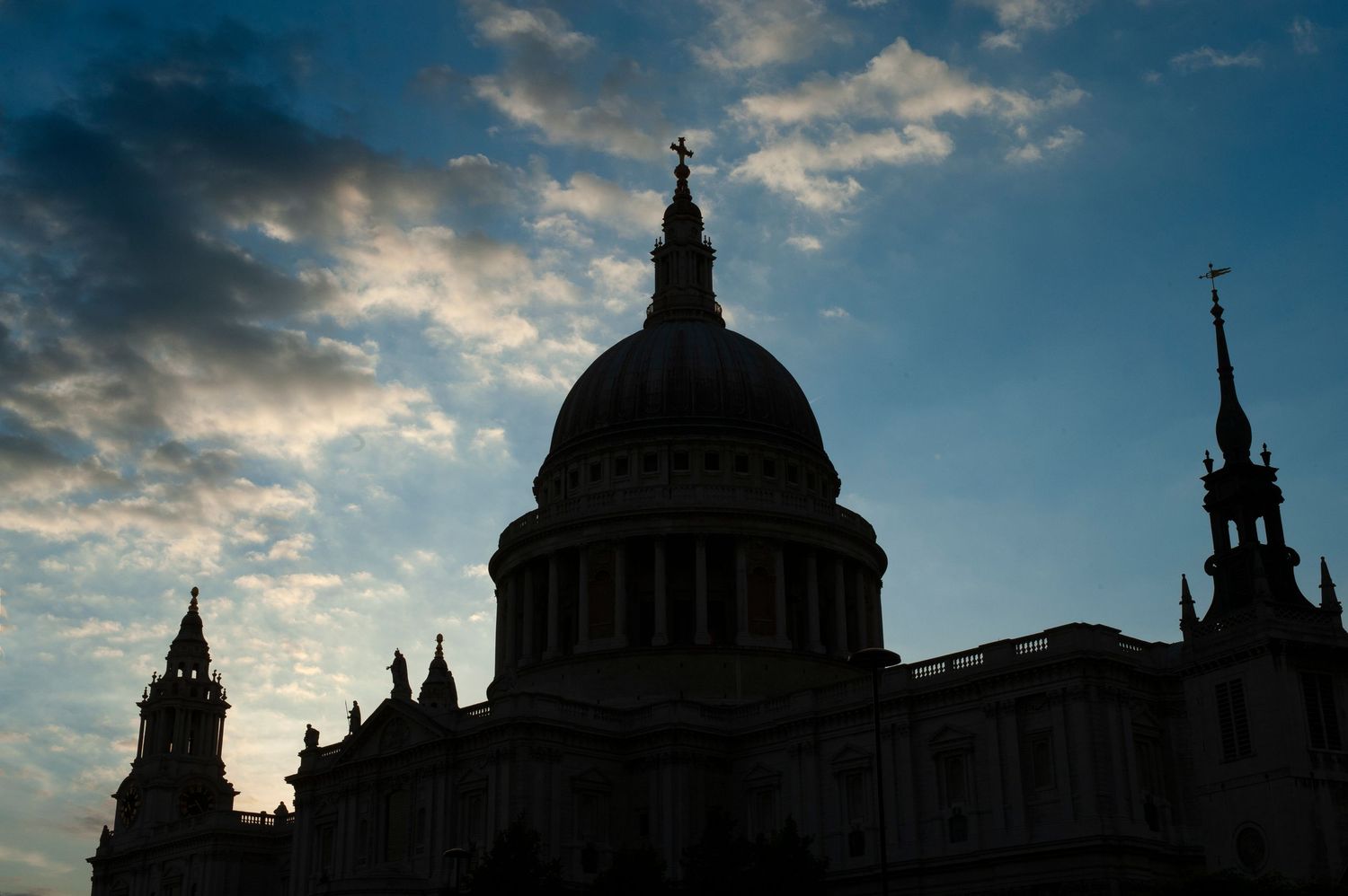 Silhouetted skyline of London showing St Paul's Cathedral and church spires at dusk.
Photograph by Danny Elwes