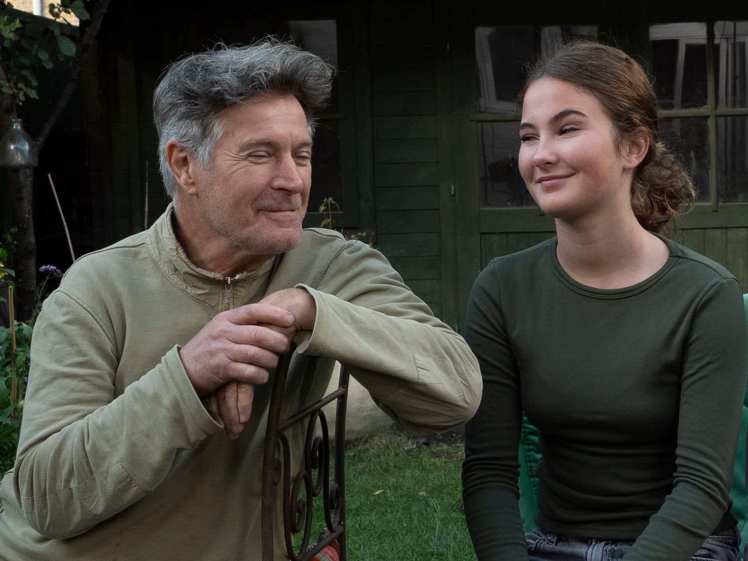 Dad and daughter sitting in their garden for family portrait for 'Before they Fly the Nest'
Photograph by Danny Elwes