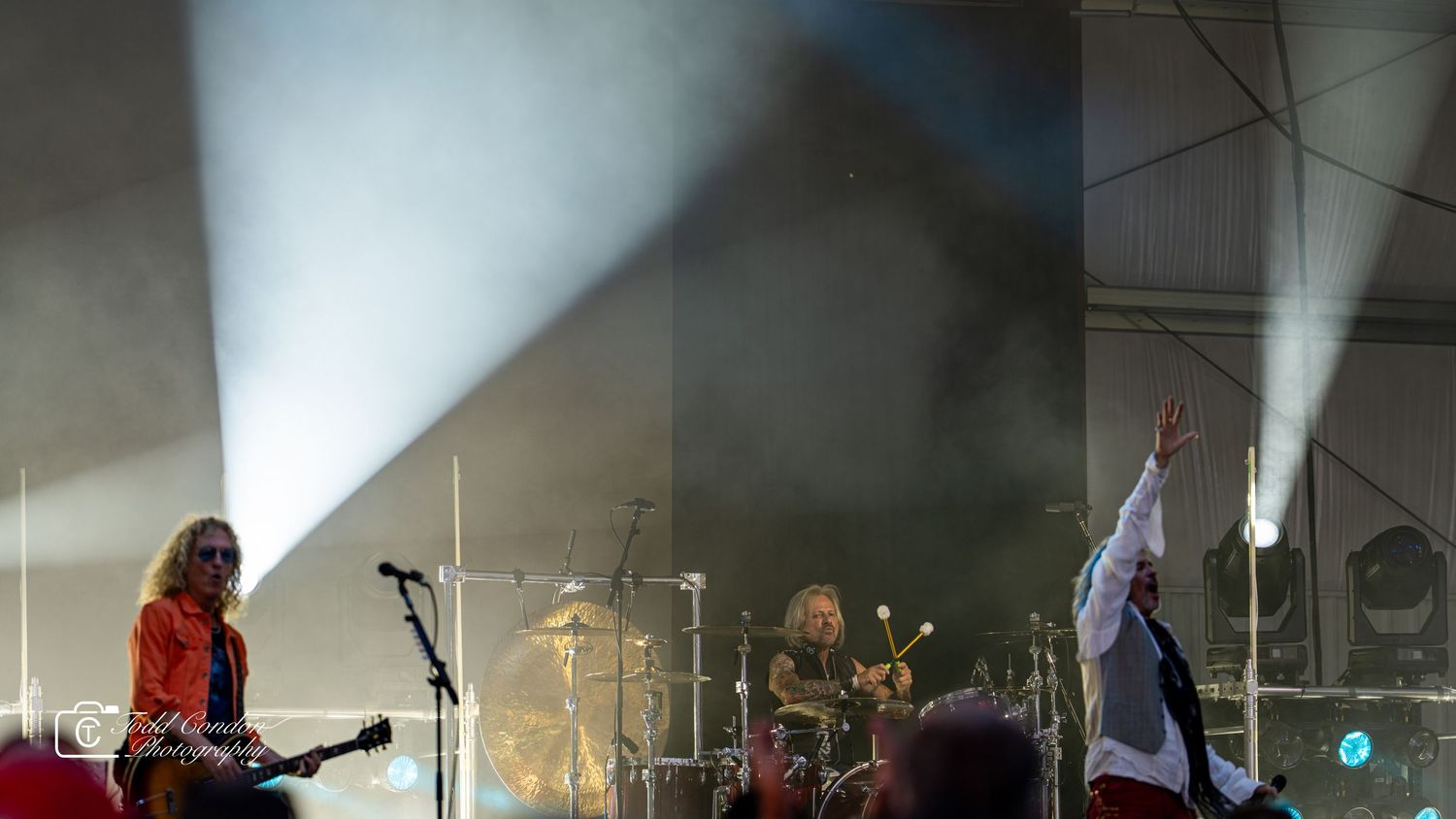 A collage of concert performance photos showing musicians on stage with dramatic lighting and fog effects.