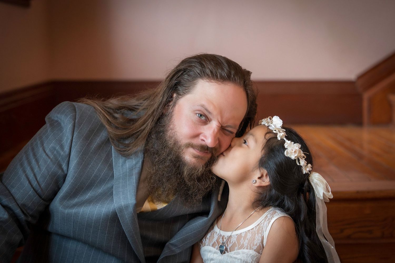 A romantic wedding photo collage showing intimate moments between newlyweds in an indoor setting.