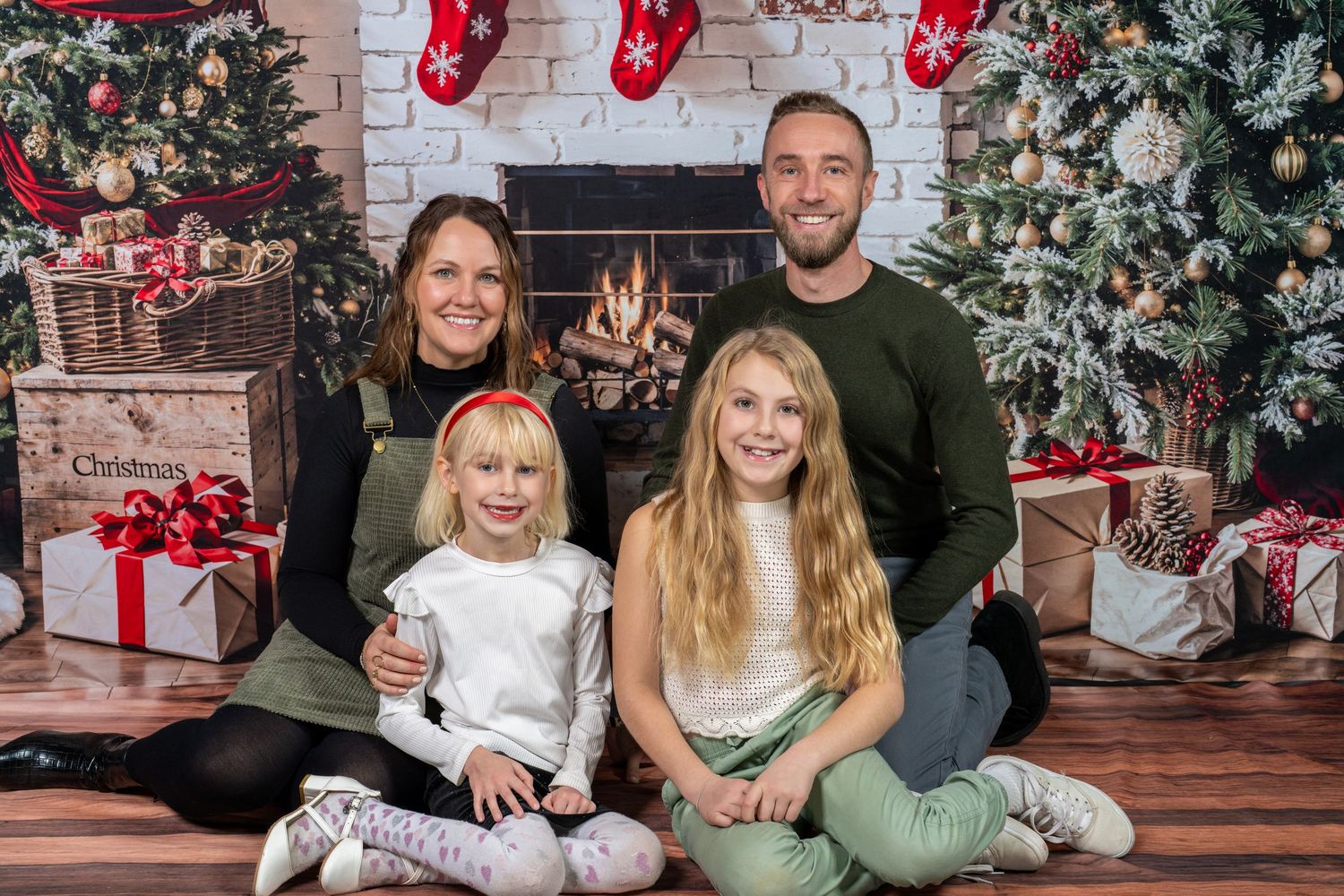 A festive holiday photo collage with Christmas trees, stockings, and decorative settings in warm seasonal tones.