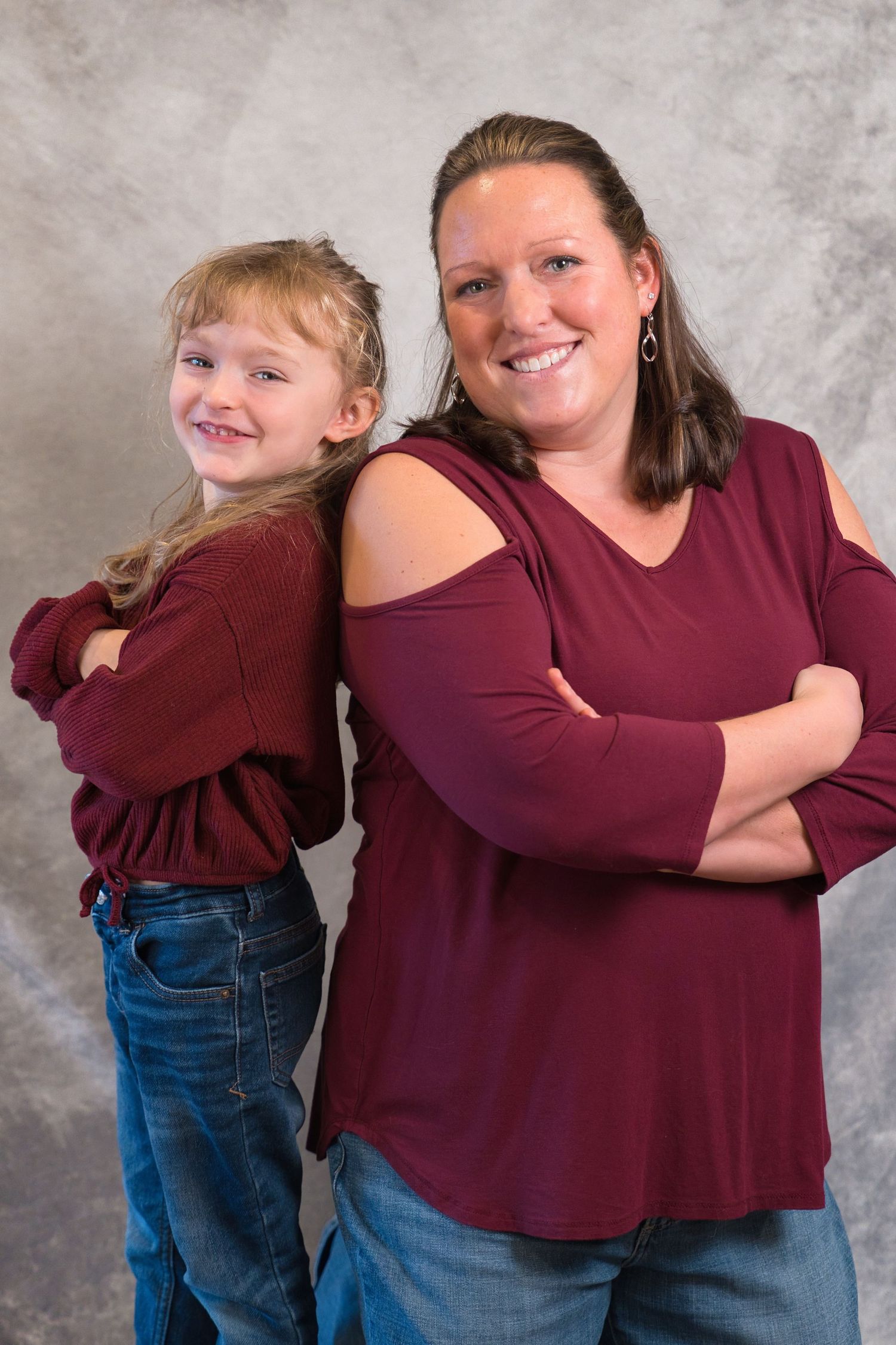 A heartwarming series of photos showing a tender embrace between two people wearing burgundy tops and jeans.