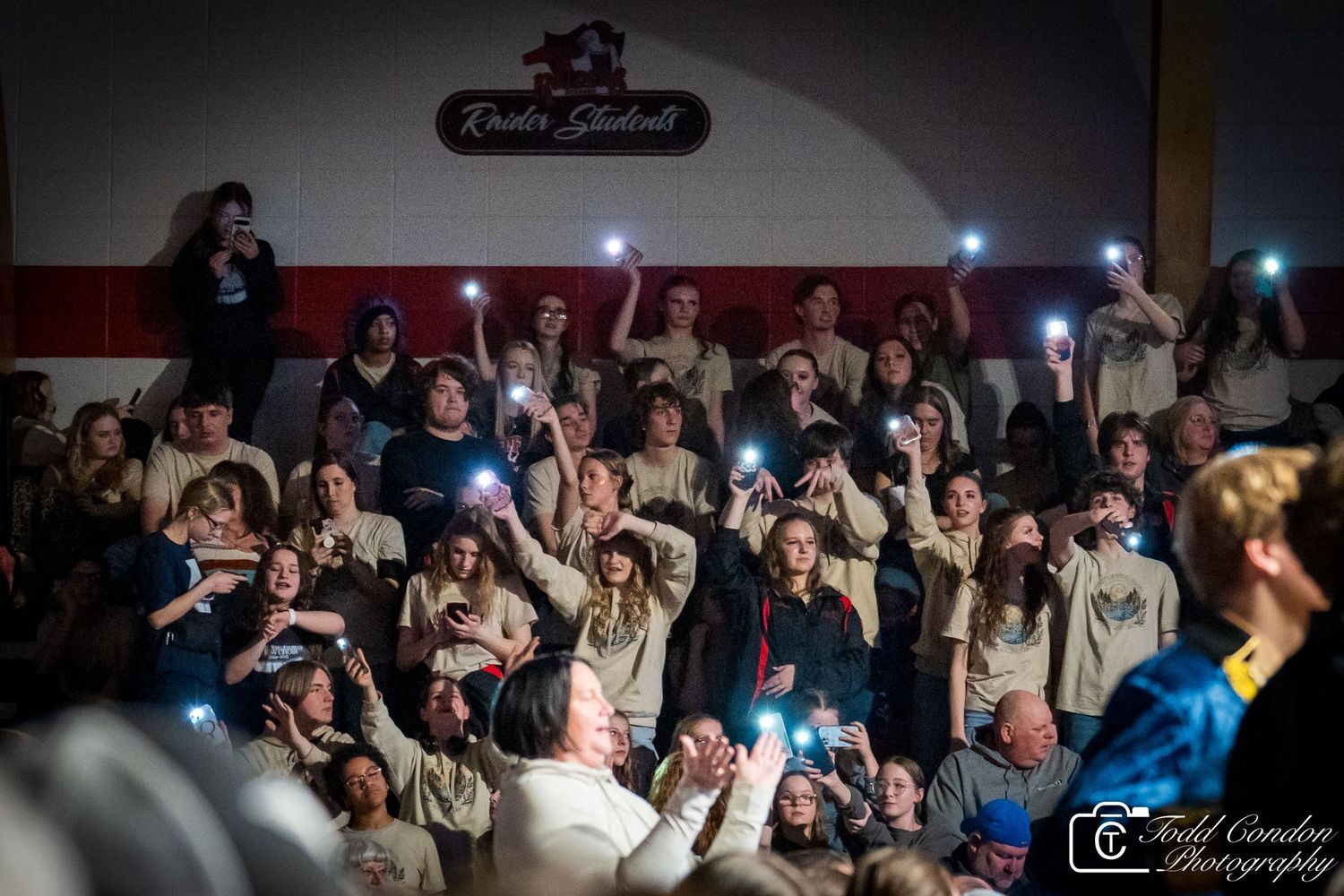 Excited crowd at a concert venue reacts enthusiastically during a live performance.