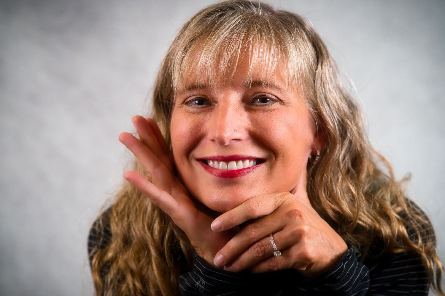 A series of expressive headshots showing various emotions and poses against a light background.