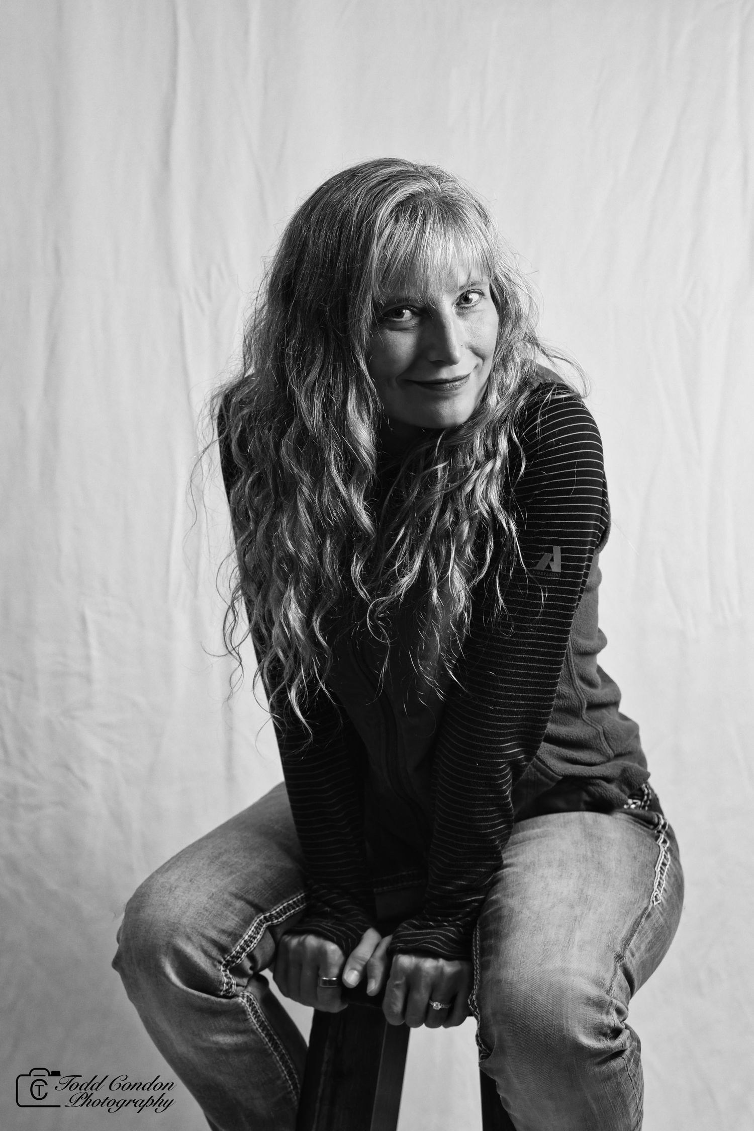 Black and white artistic portrait series showing dynamic poses against a white backdrop.