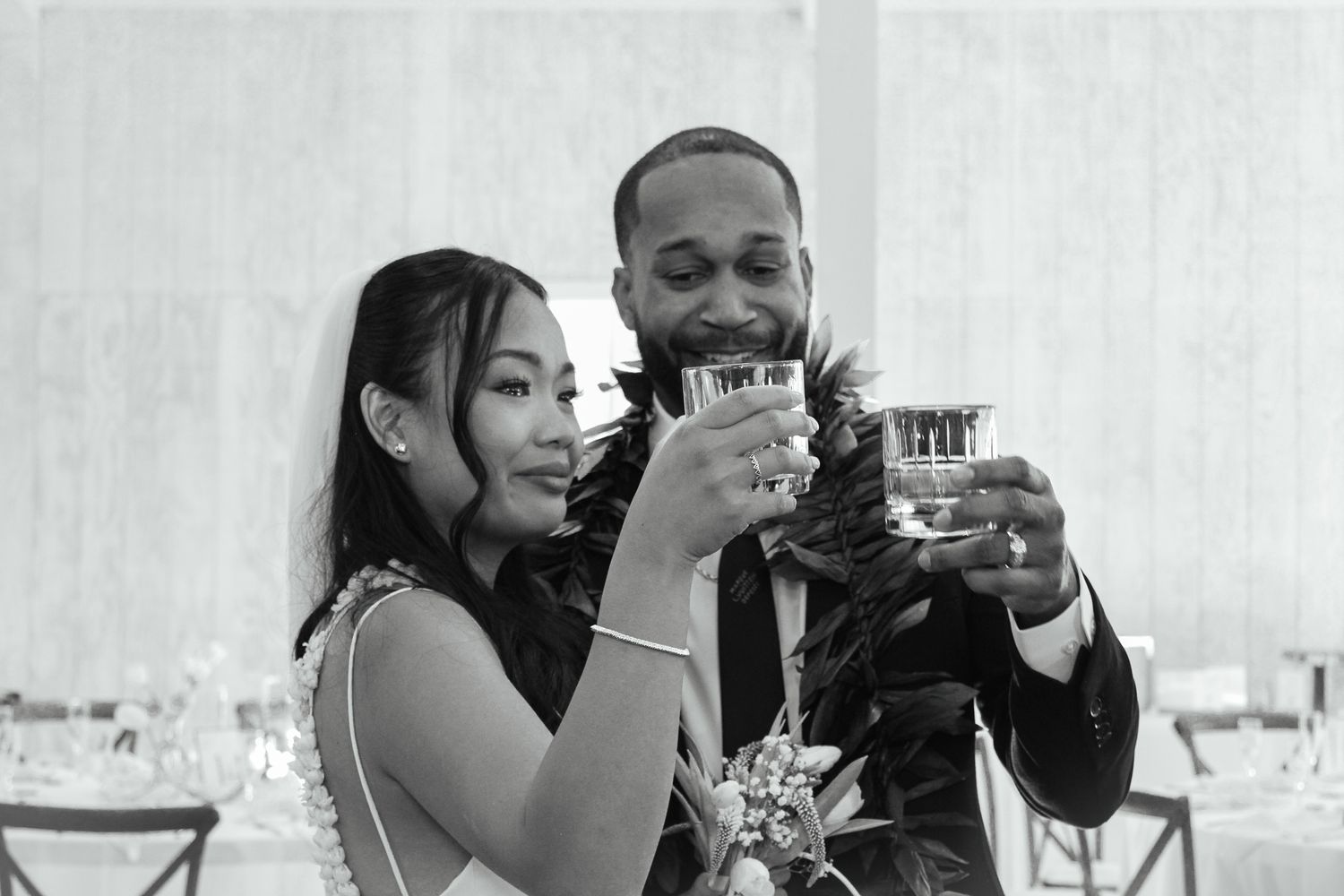 Bride and groom sharing an emotional toast after getting married.