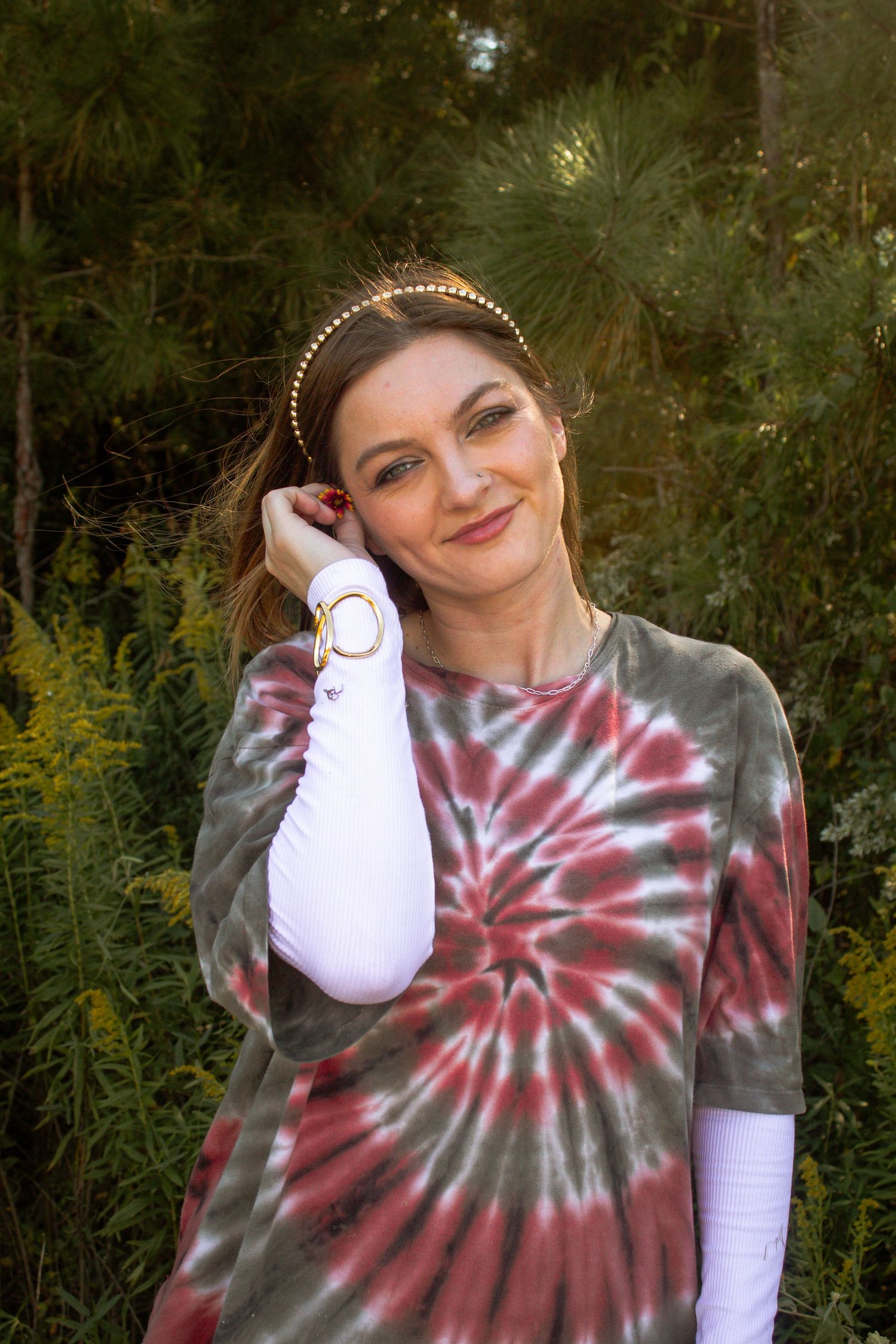posing with a flower