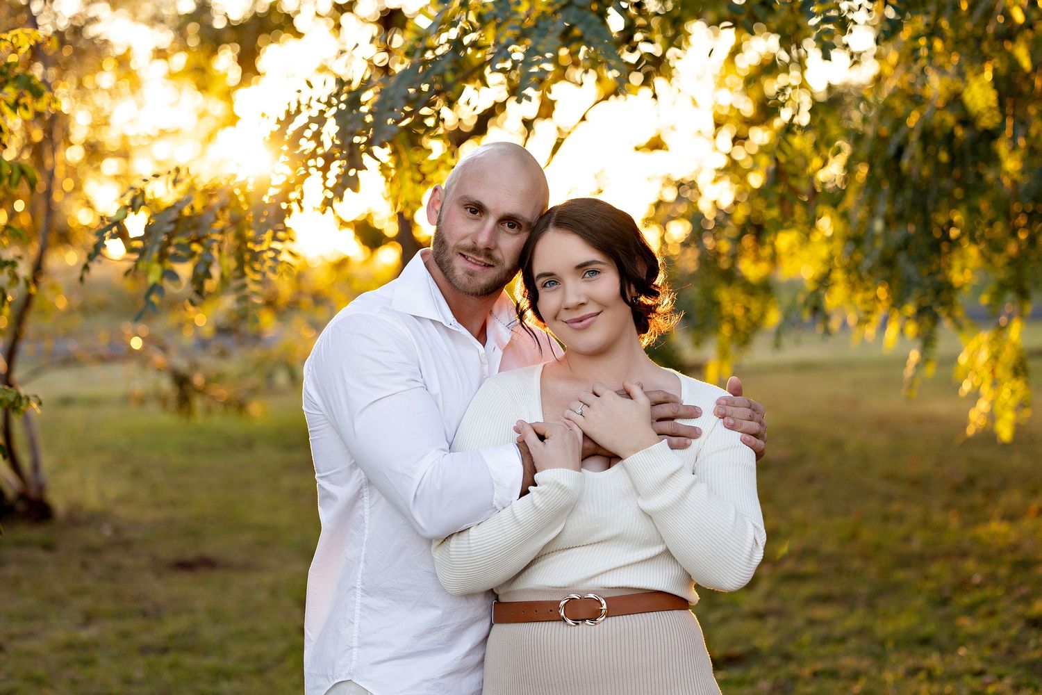 Family photo session in a golden sunset setting with autumn trees in the backgroundToowoomba Photographer Toowoomba Newborn Photographer