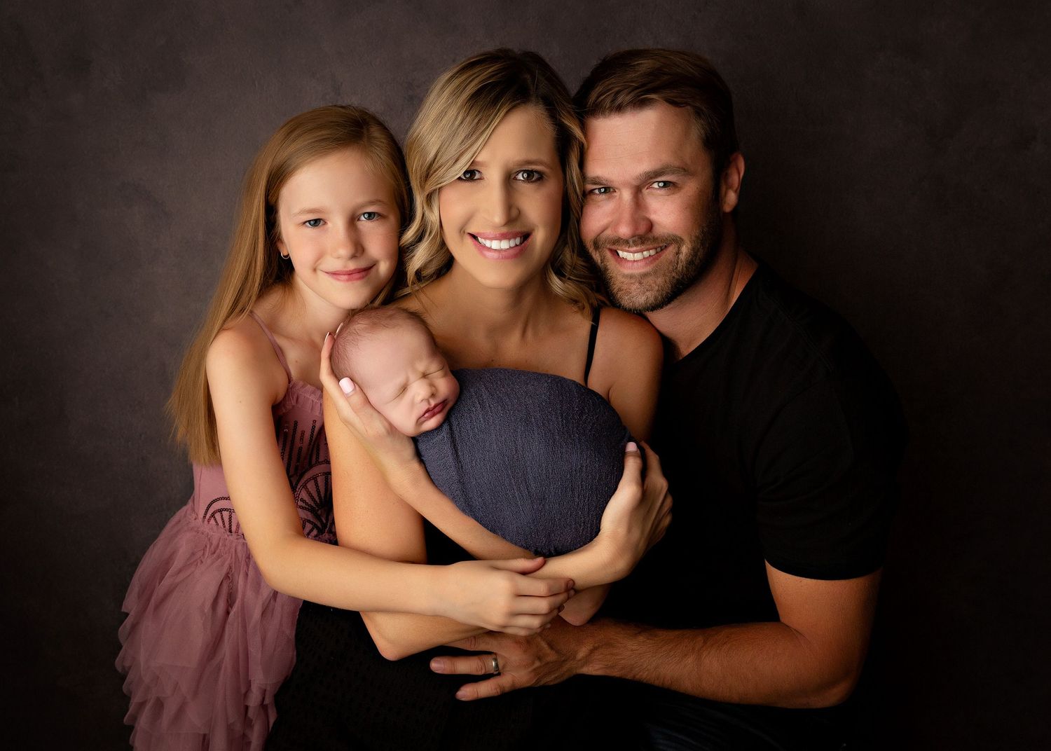 Professional portrait series showing intimate family moments against a dark background.Toowoomba Photographer Toowoomba Newborn Photographer