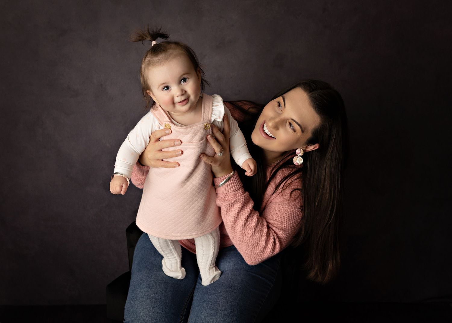 Candid family moments captured in black and white photography against dark backdropToowoomba Photographer Toowoomba Newborn Photographer