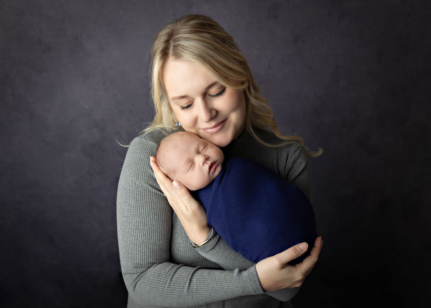 A series of intimate portraits showing tender embraces and emotional moments against a dark background.