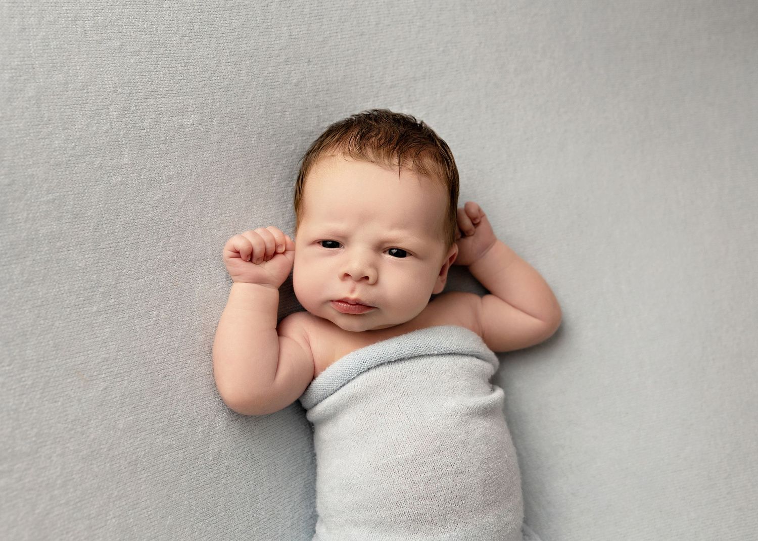 Simple studio newborn portraits against light grey background showing natural posesToowoomba Photographer Toowoomba Newborn Photographer