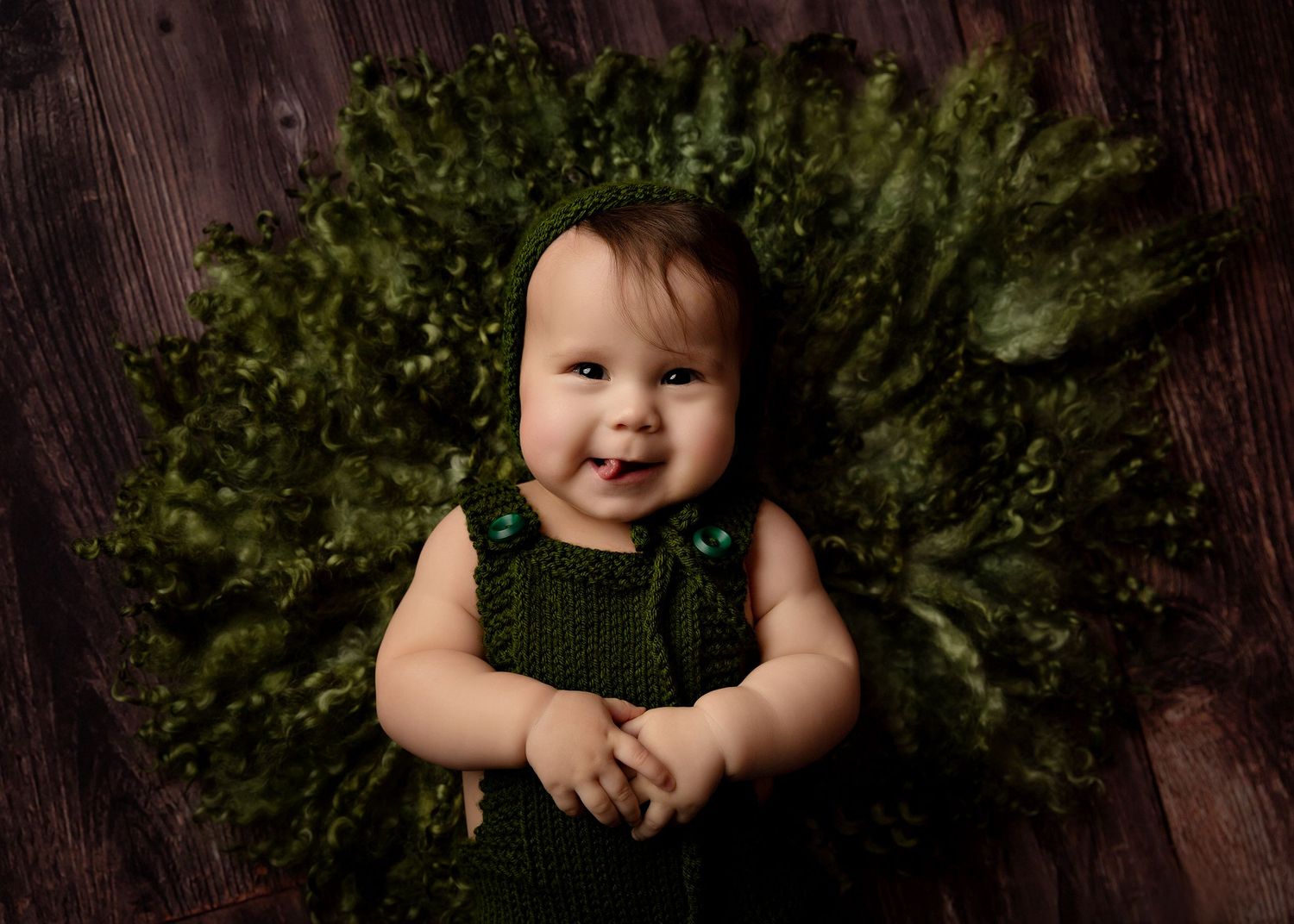 Artistic child portraits against dark wooden background with greenery Toowoomba Photographer Toowoomba Newborn Photographer